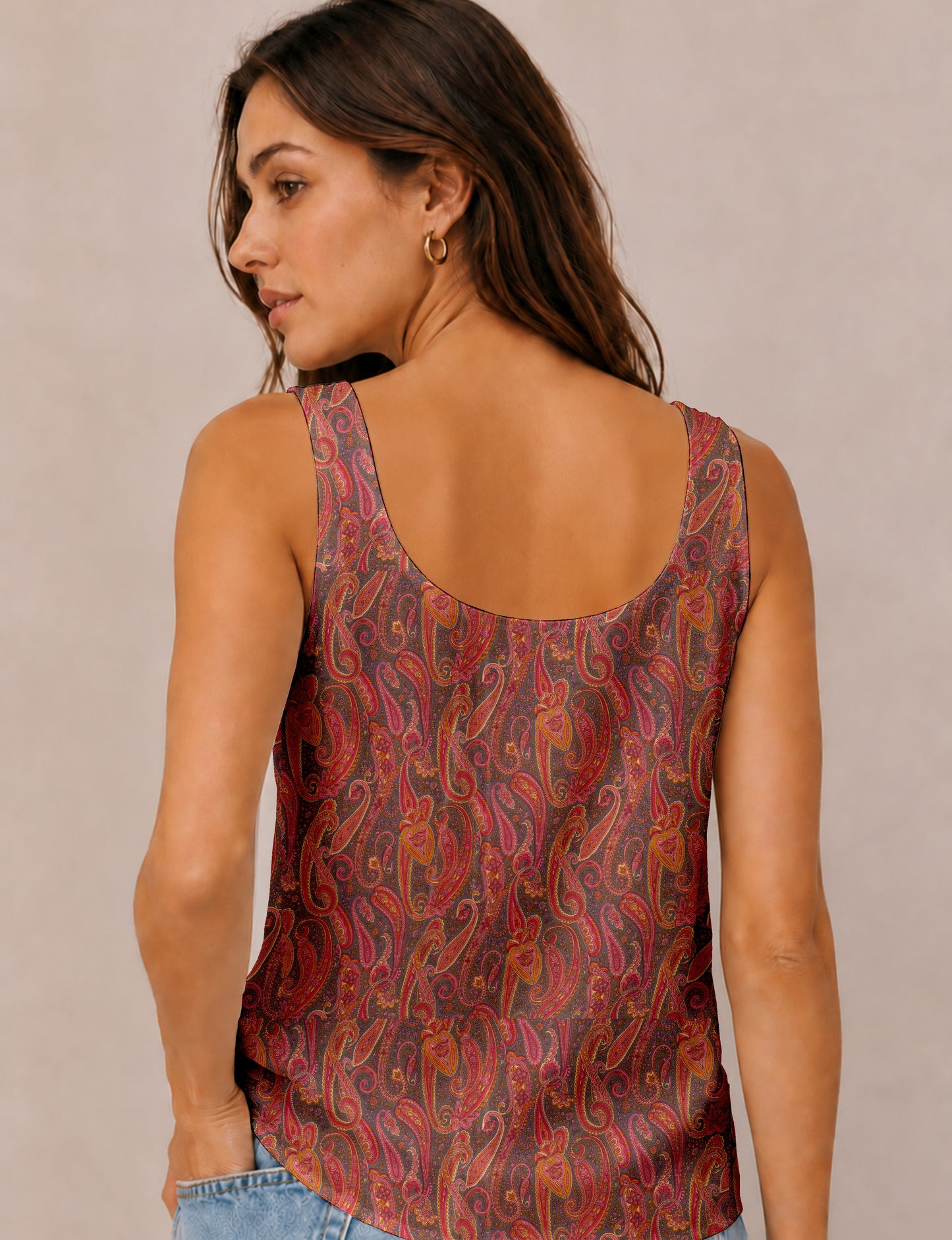 Women's sleeveless blouse with a relaxed straight fit, wide scoop neckline, deep scoop back, and hip-length silhouette.