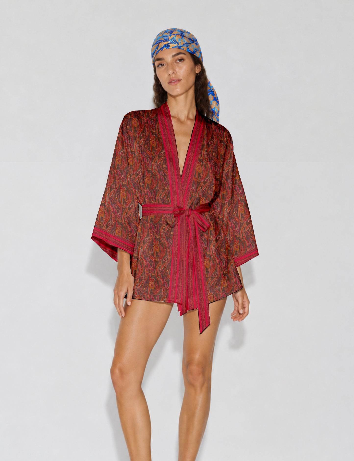 Short kimono robe with wrap front, V-neckline, wide sleeves, waist tie, and concealed skort detail.