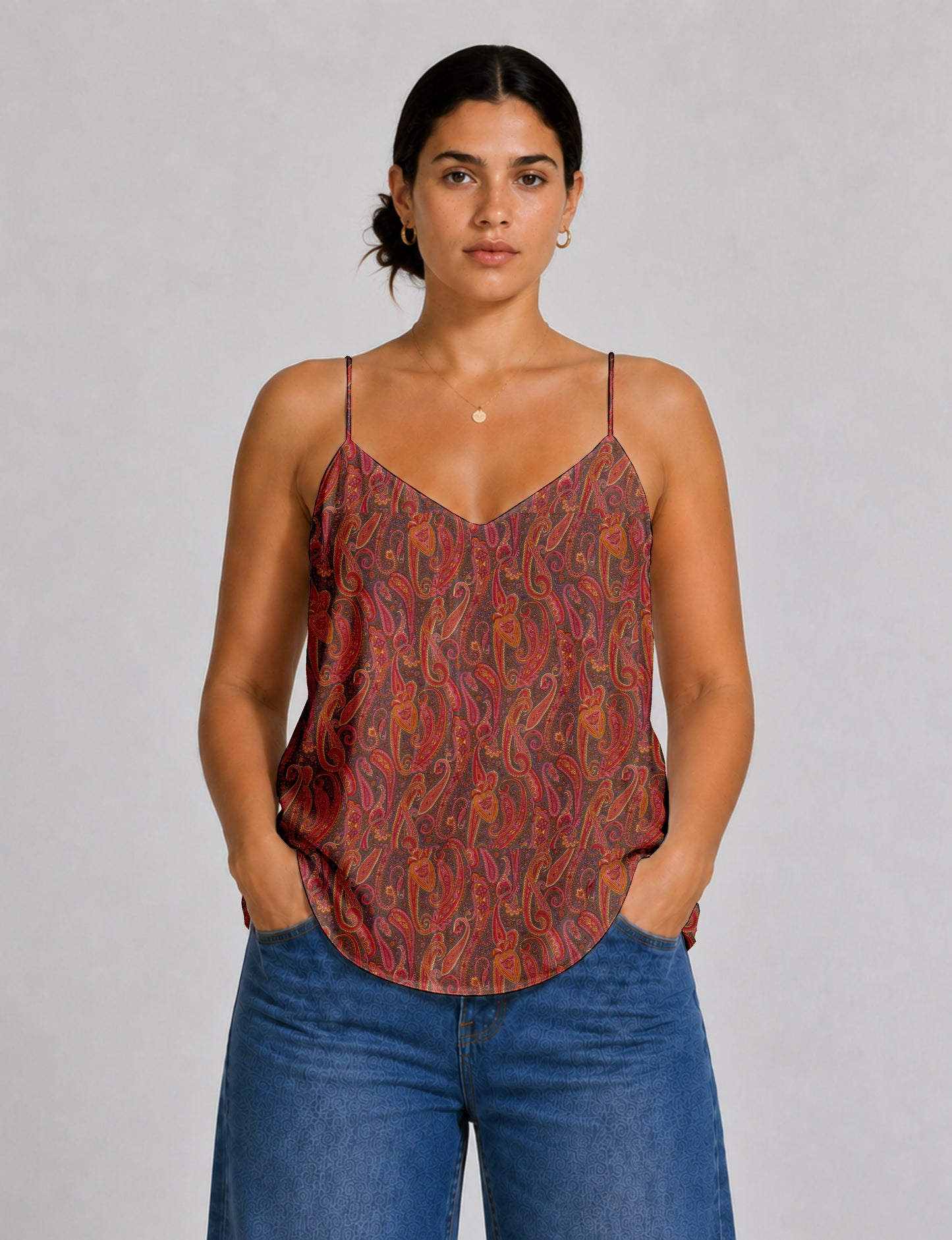 Women's sleeveless slip top with a relaxed straight fit, soft V-neckline, deep V-back, and delicate spaghetti straps.