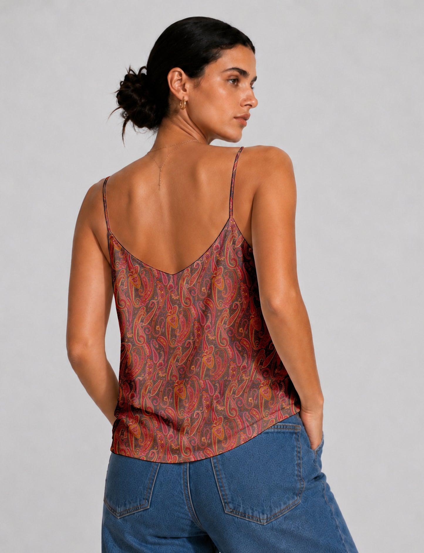 Women's sleeveless slip top with a relaxed straight fit, soft V-neckline, deep V-back, and delicate spaghetti straps.