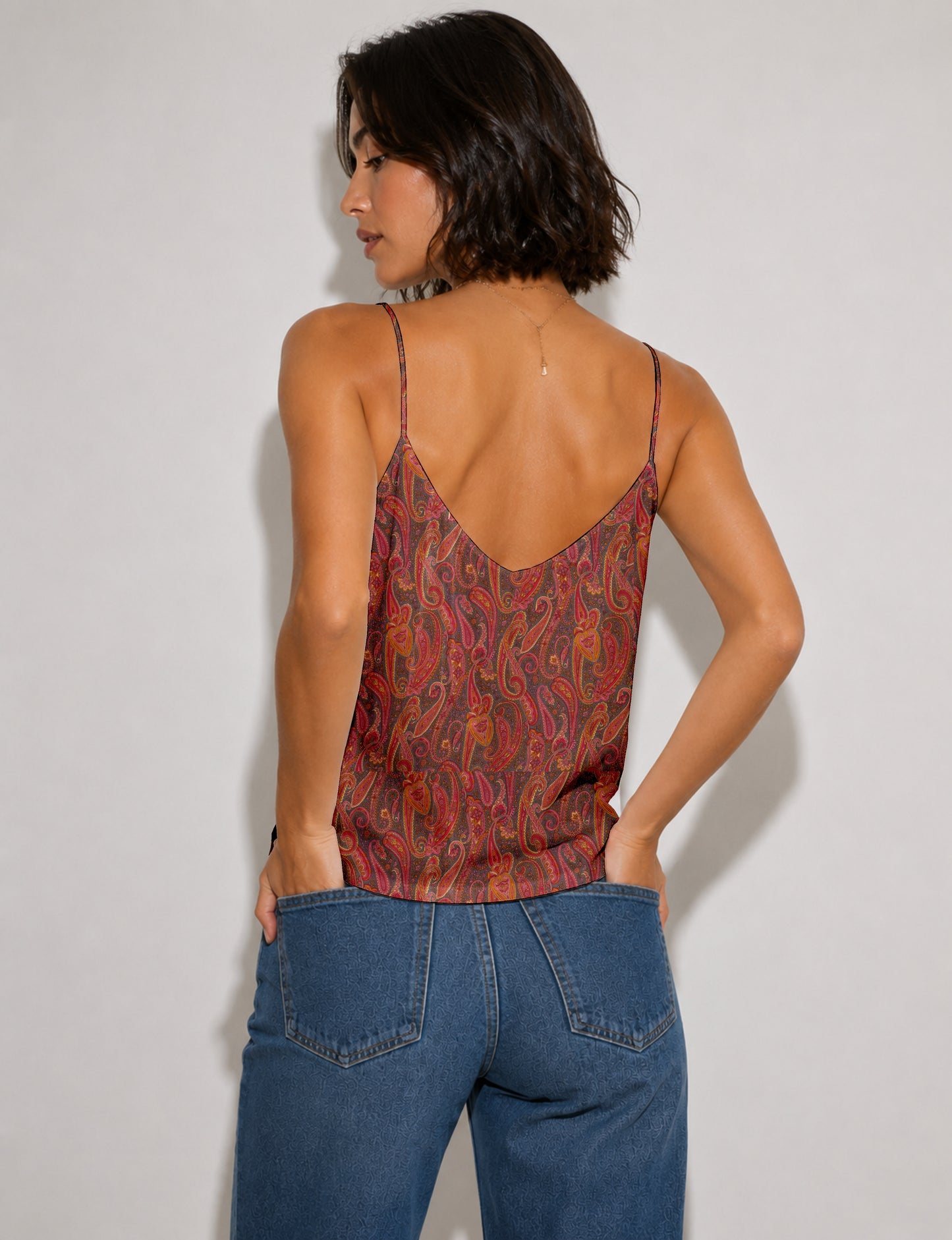 Women's sleeveless slip top with a relaxed straight fit, soft V-neckline, deep V-back, and delicate spaghetti straps.