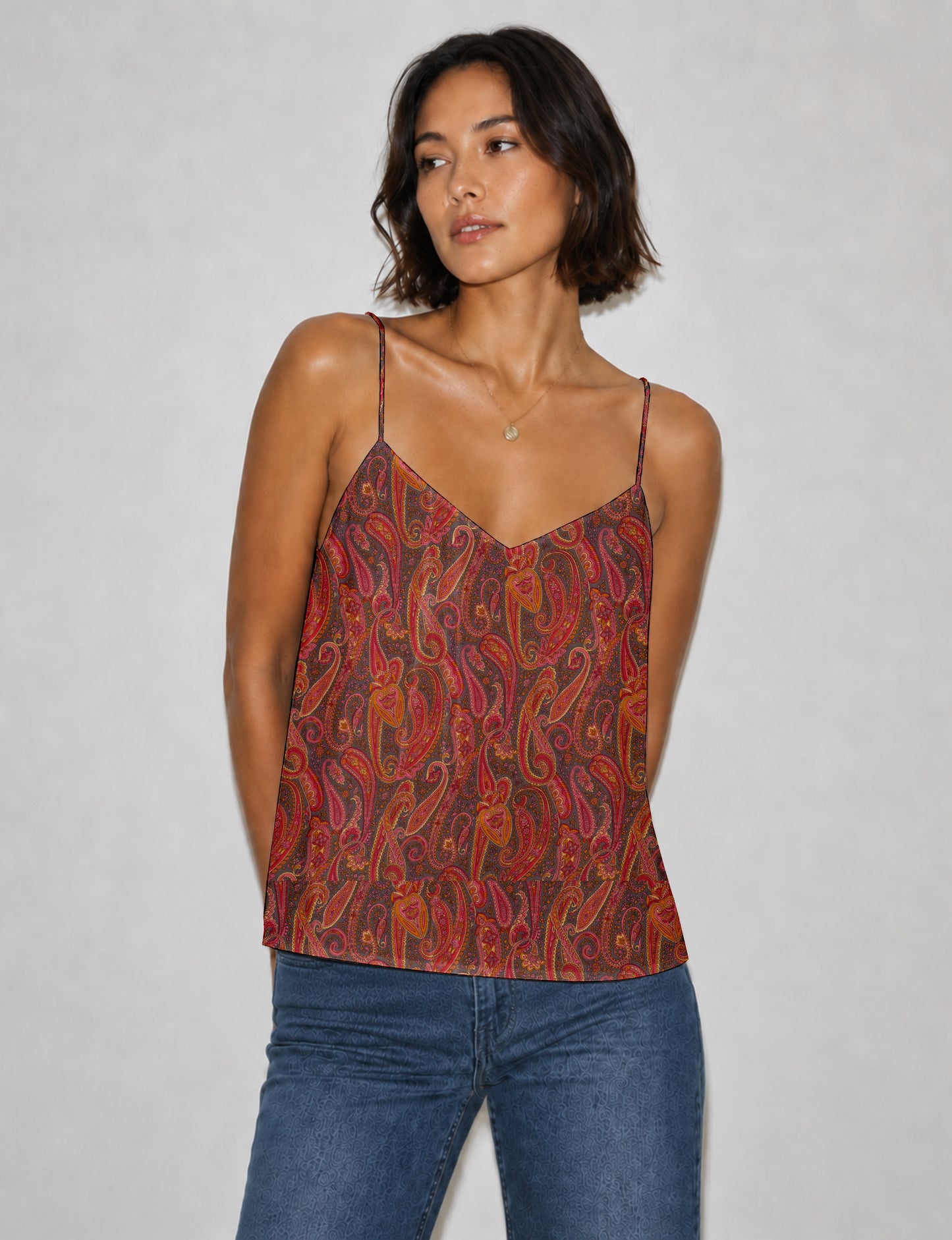 Women's sleeveless slip top with a relaxed straight fit, soft V-neckline, deep V-back, and delicate spaghetti straps.