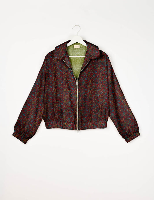 Upcycled Bomber Jacket made from recycled sari materials, featuring a cute cropped shape, elasticated hem and cuffs, and contrast sari print lining. Sustainable apparel promoting eco-friendly fashion and ethical clothing.