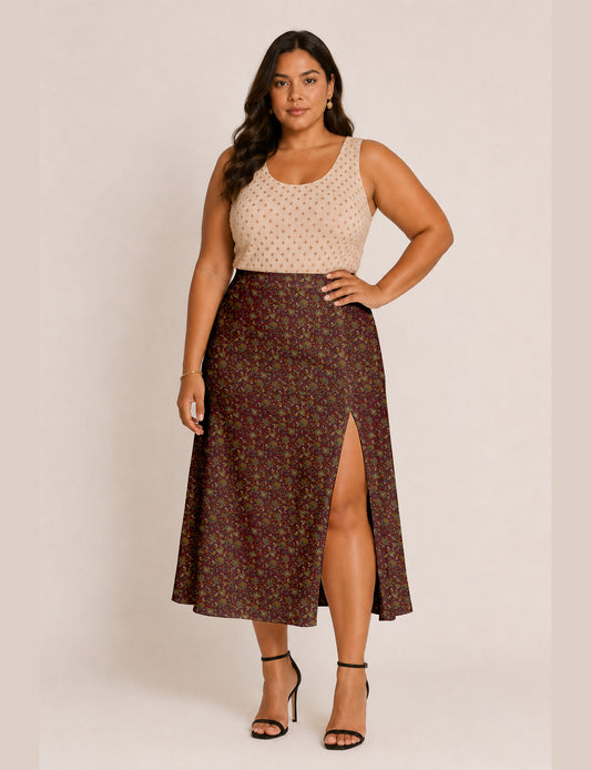 Woman wearing a yellow and black micro patterned A-line skirt with front slit, paired with beige sleeveless top and black