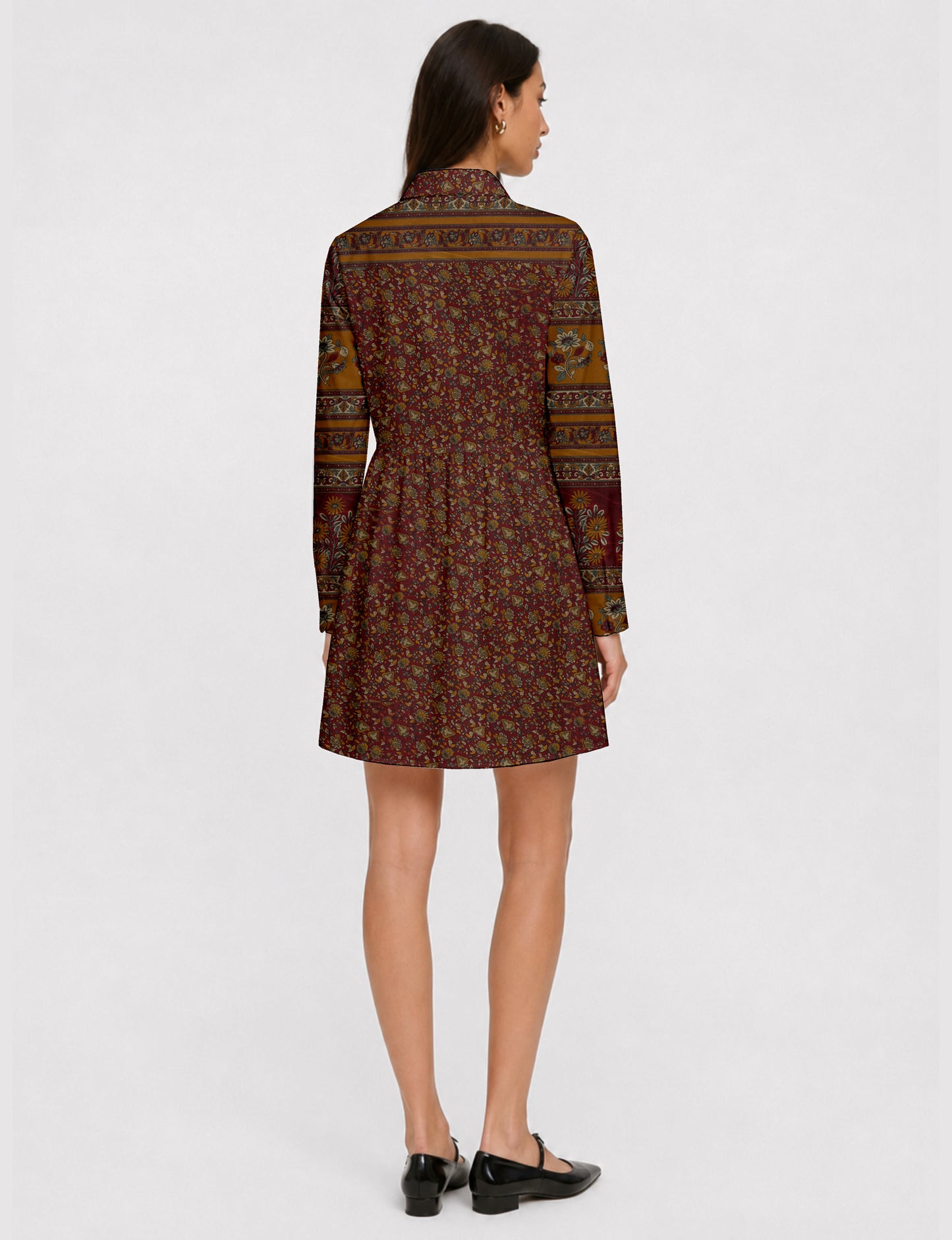 Short shirt dress with a relaxed A-line silhouette, point collar, partial button placket, gathered waist, side pockets, and full-length cuffed sleeves.
