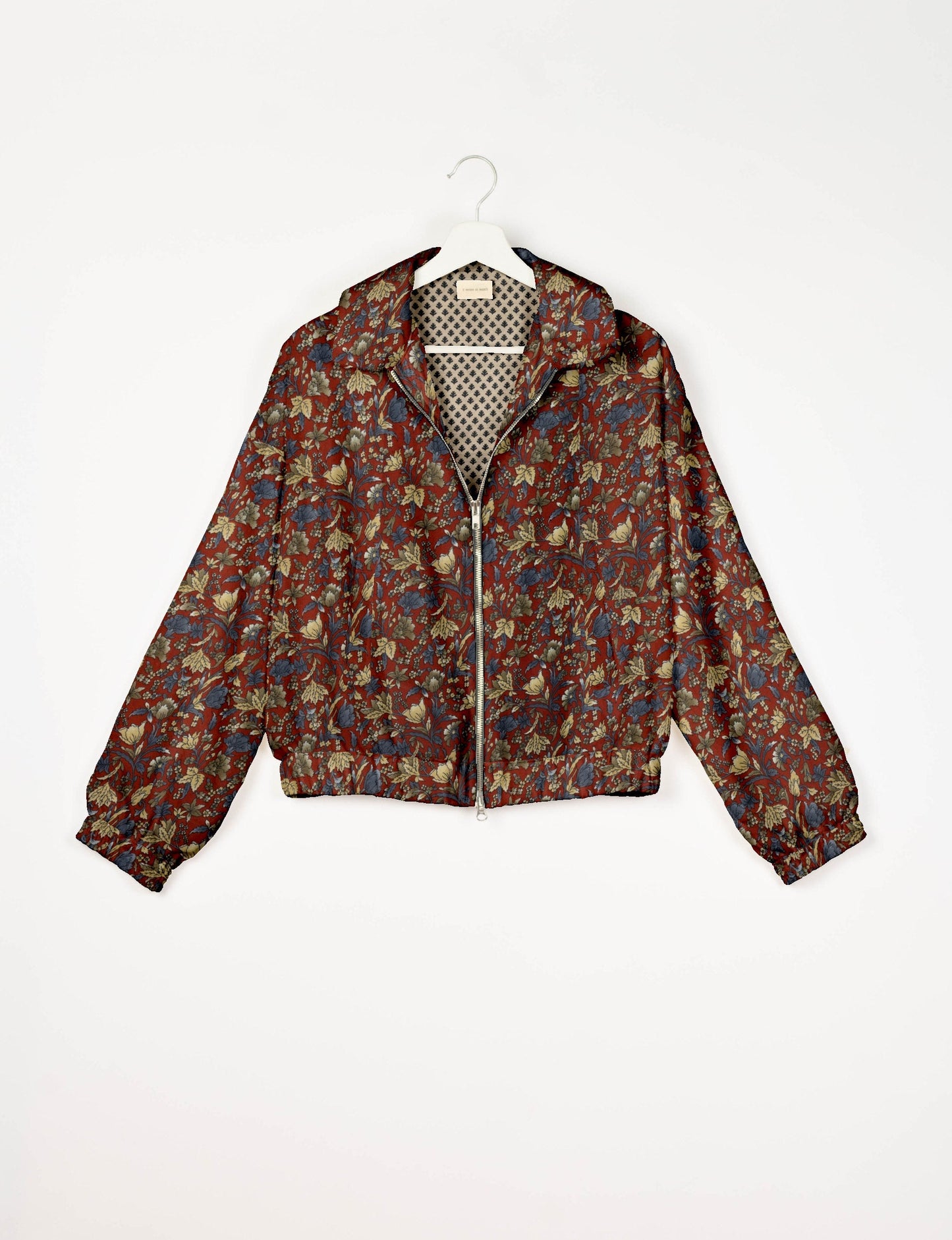 Upcycled Bomber Jacket made from recycled sari materials, featuring a cute cropped shape, elasticated hem and cuffs, and contrast sari print lining. Sustainable apparel promoting eco-friendly fashion and ethical clothing.