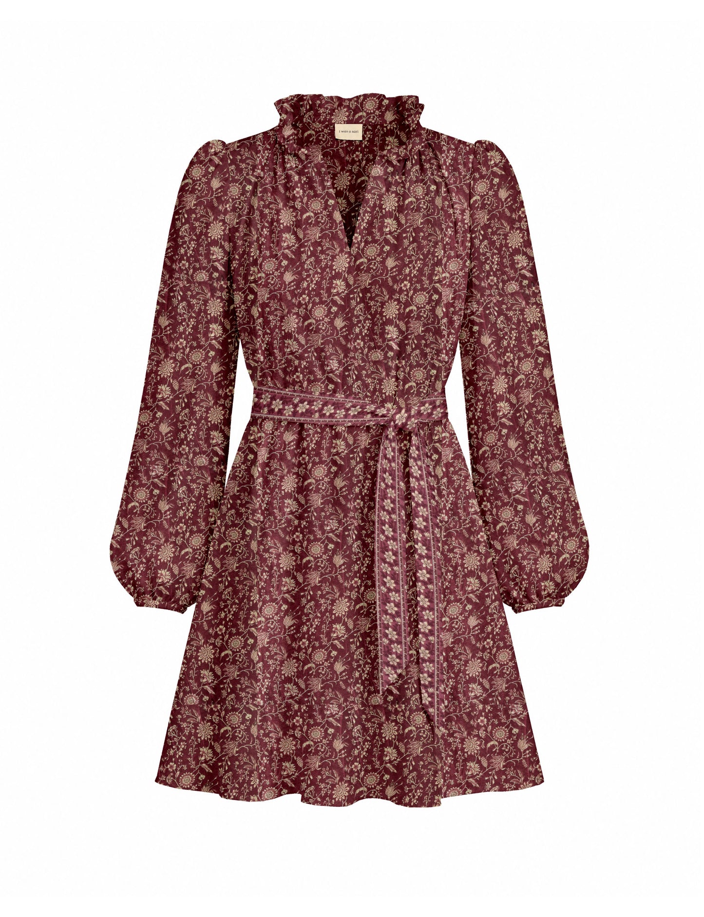 Swing dress with detachable tie belt, gathered ruffle neckline, full-length voluminous sleeves, elastic cuffs, and relaxed A-line silhouette in an above-knee length.