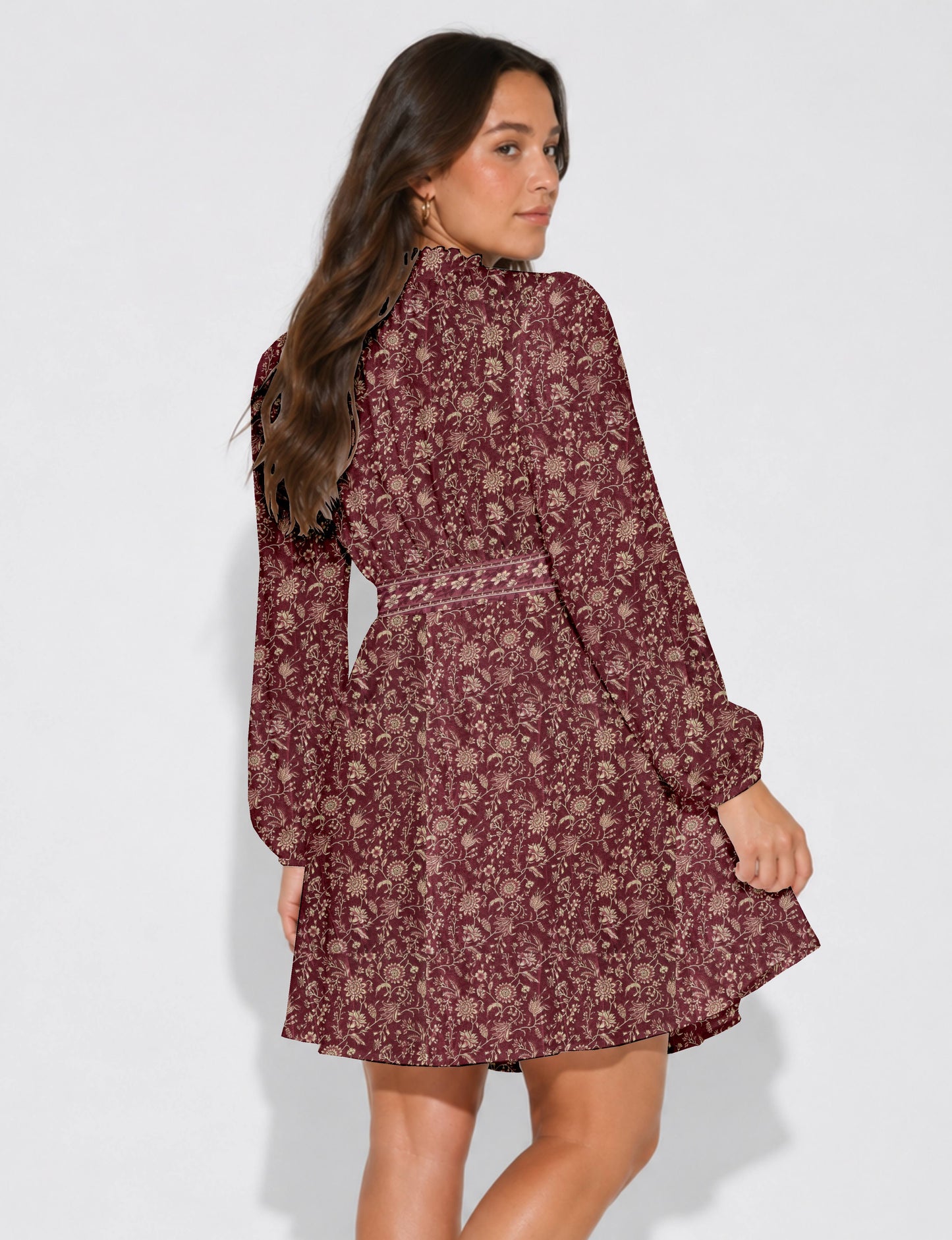 Swing dress with detachable tie belt, gathered ruffle neckline, full-length voluminous sleeves, elastic cuffs, and relaxed A-line silhouette in an above-knee length.