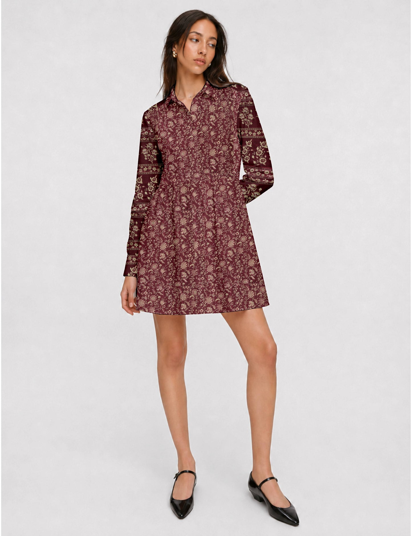 Short shirt dress with a relaxed A-line silhouette, point collar, partial button placket, gathered waist, side pockets, and full-length cuffed sleeves.