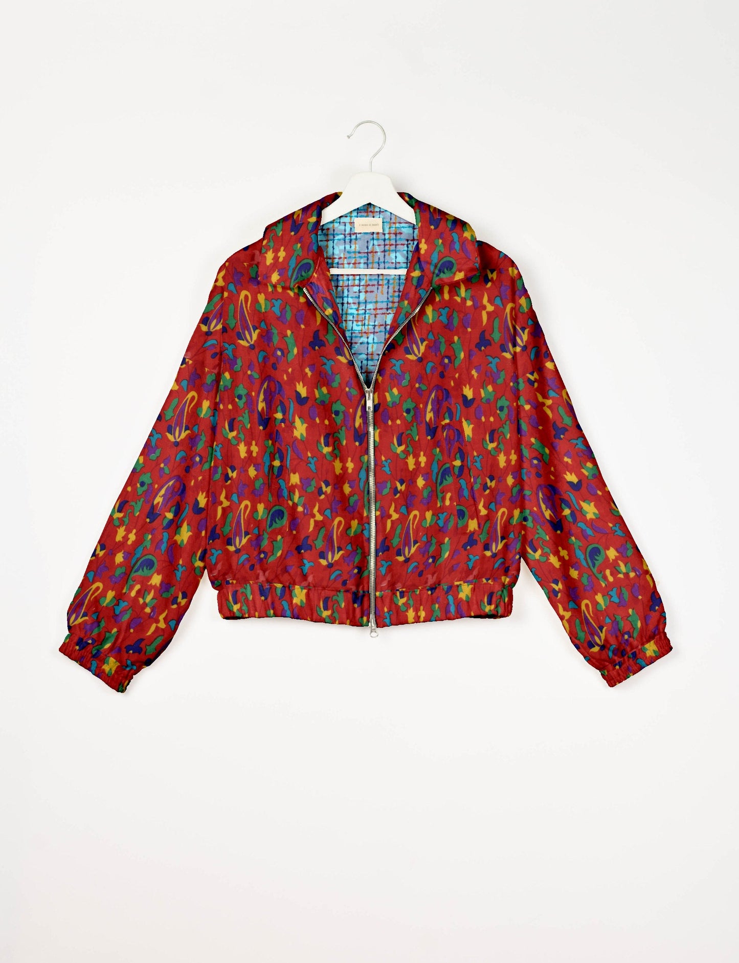 Upcycled Bomber Jacket made from recycled sari materials, featuring a cute cropped shape, elasticated hem and cuffs, and contrast sari print lining. Sustainable apparel promoting eco-friendly fashion and ethical clothing.