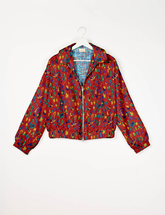 Upcycled Bomber Jacket made from recycled sari materials, featuring a cute cropped shape, elasticated hem and cuffs, and contrast sari print lining. Sustainable apparel promoting eco-friendly fashion and ethical clothing.