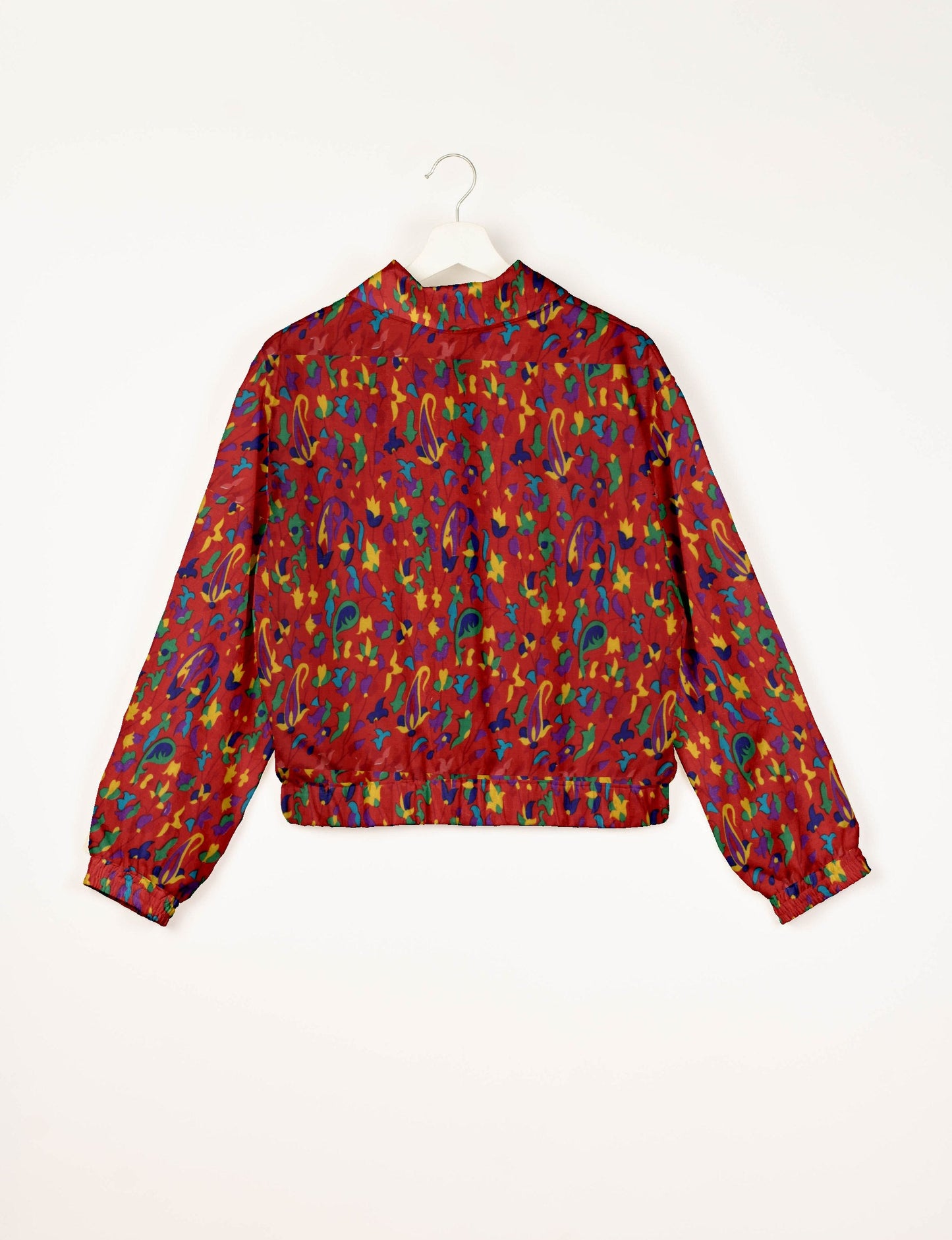Upcycled Bomber Jacket made from recycled sari materials, featuring a cute cropped shape, elasticated hem and cuffs, and contrast sari print lining. Sustainable apparel promoting eco-friendly fashion and ethical clothing.