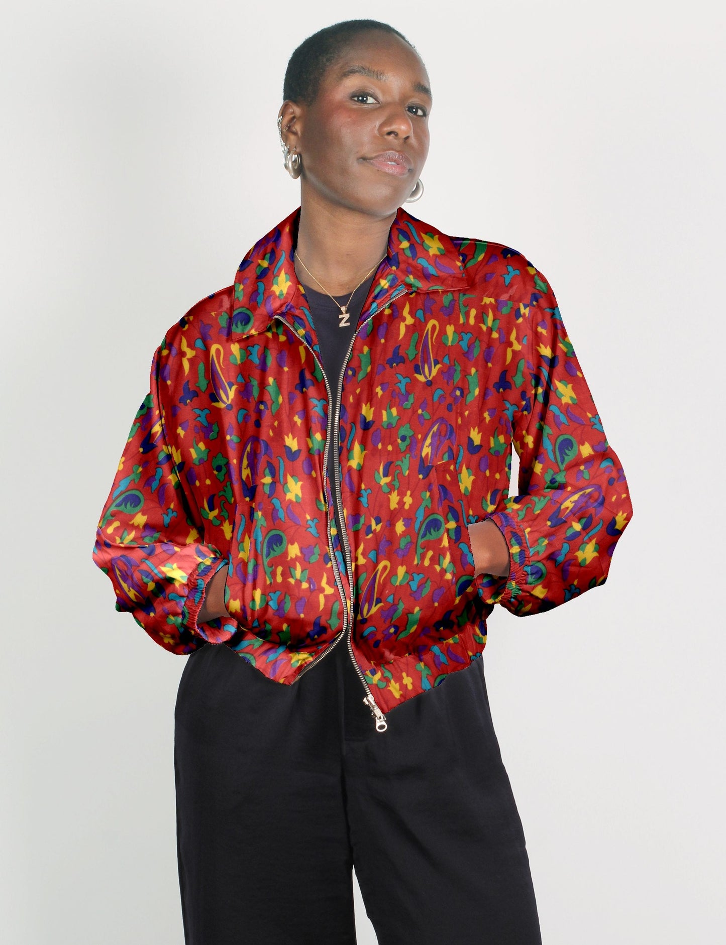 Upcycled Bomber Jacket made from recycled sari materials, featuring a cute cropped shape, elasticated hem and cuffs, and contrast sari print lining. Sustainable apparel promoting eco-friendly fashion and ethical clothing.