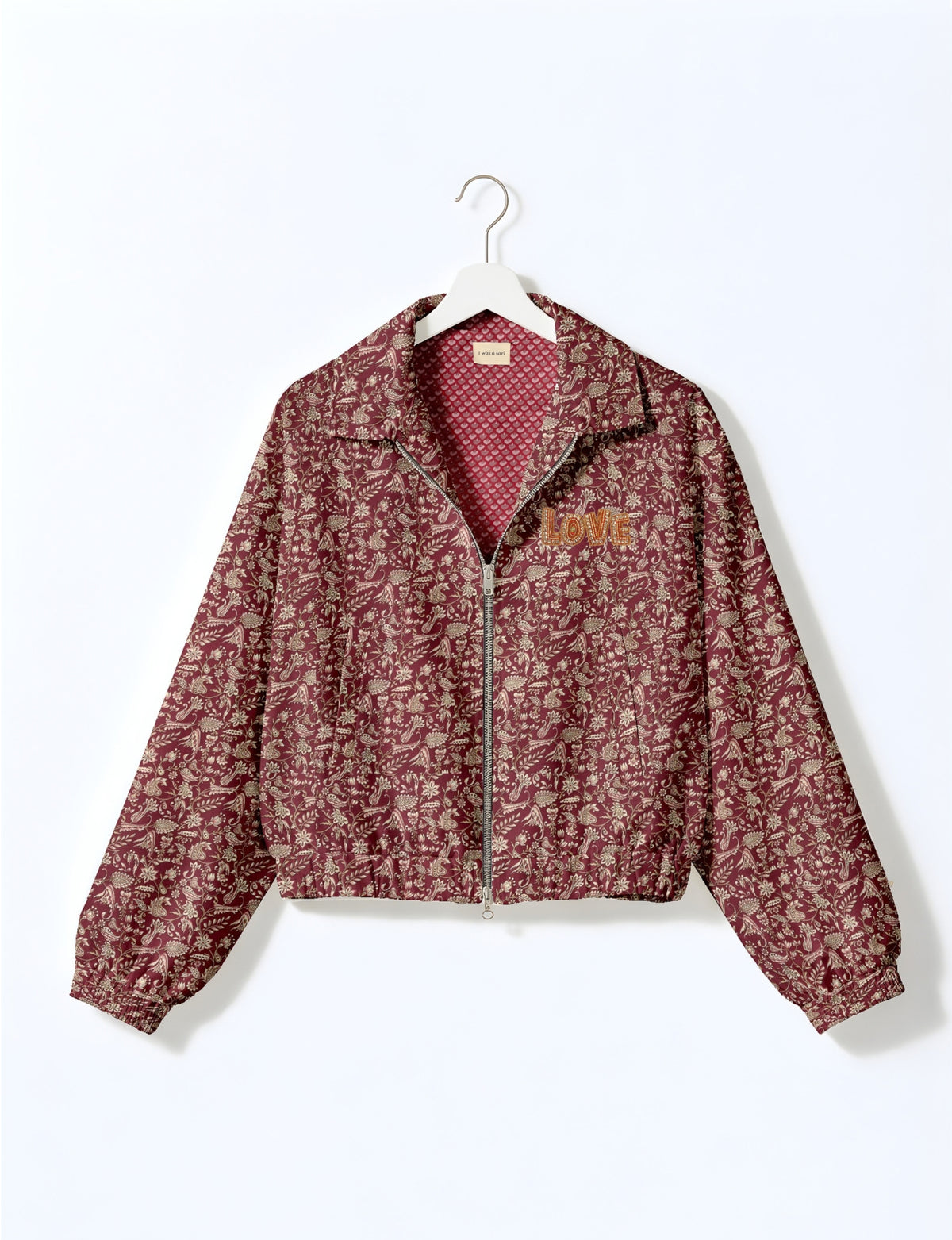 Love Bomber Jacket made from recycled fabric, featuring hand-stitched Aari embroidery. A unique piece of zero-waste clothing, part of the circular fashion movement. Designed with upcycled materials for a stylish yet environmentally friendly clothing choice.