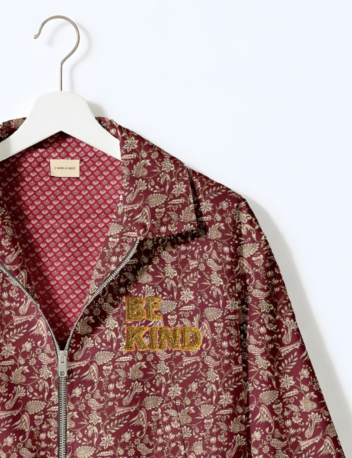BE KIND Bomber jacket made from upcycled sari fabric with handcrafted Aari embroidery by female artisans.