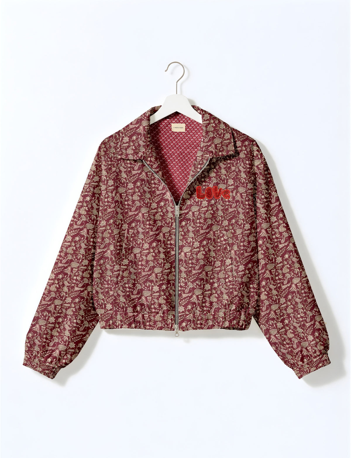 Love Bomber Jacket made from recycled fabric, featuring hand-stitched Aari embroidery. A unique piece of zero-waste clothing, part of the circular fashion movement. Designed with upcycled materials for a stylish yet environmentally friendly clothing choice.