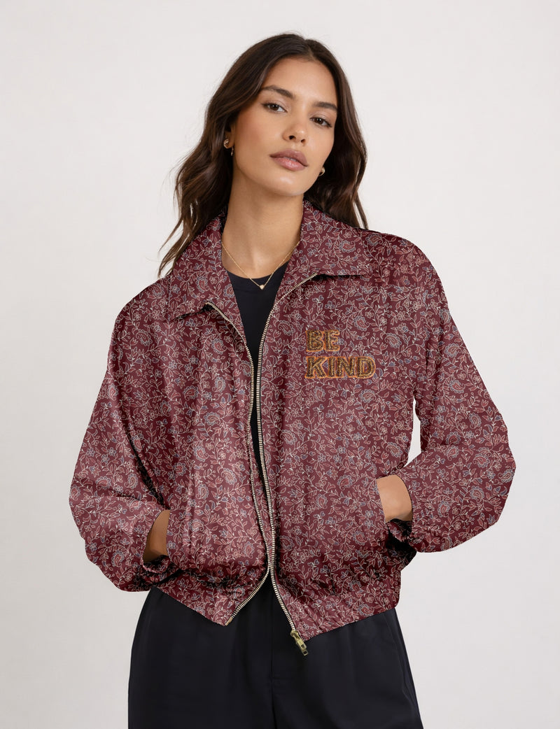 BE KIND Bomber jacket made from upcycled sari fabric with handcrafted Aari embroidery by female artisans.