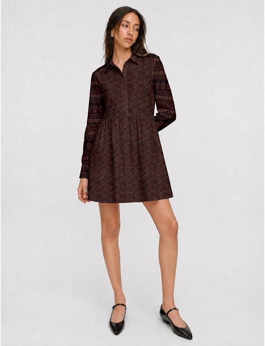 Short shirt dress with a relaxed A-line silhouette, point collar, partial button placket, gathered waist, side pockets, and full-length cuffed sleeves.