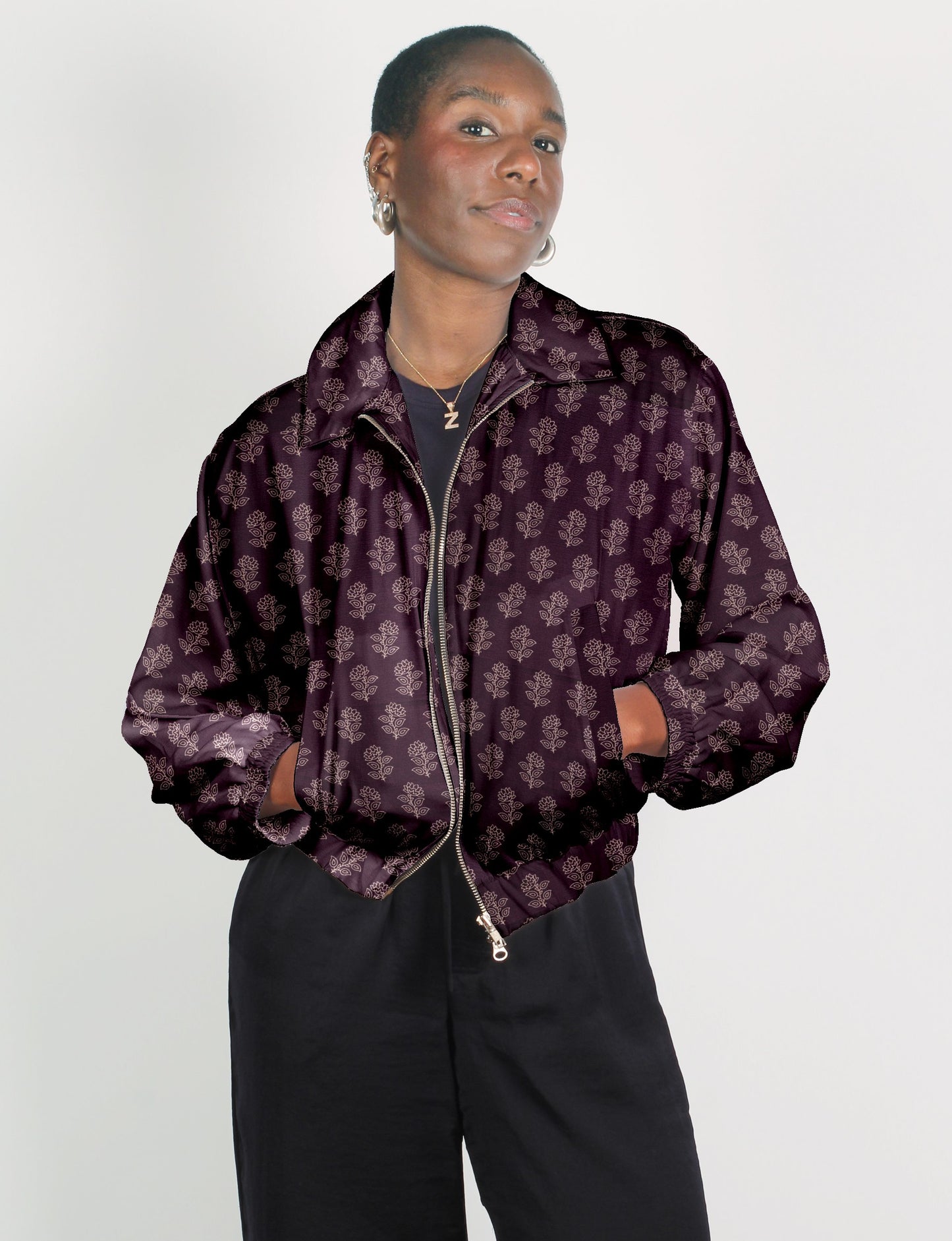 Upcycled Bomber Jacket made from recycled sari materials, featuring a cute cropped shape, elasticated hem and cuffs, and contrast sari print lining. Sustainable apparel promoting eco-friendly fashion and ethical clothing.