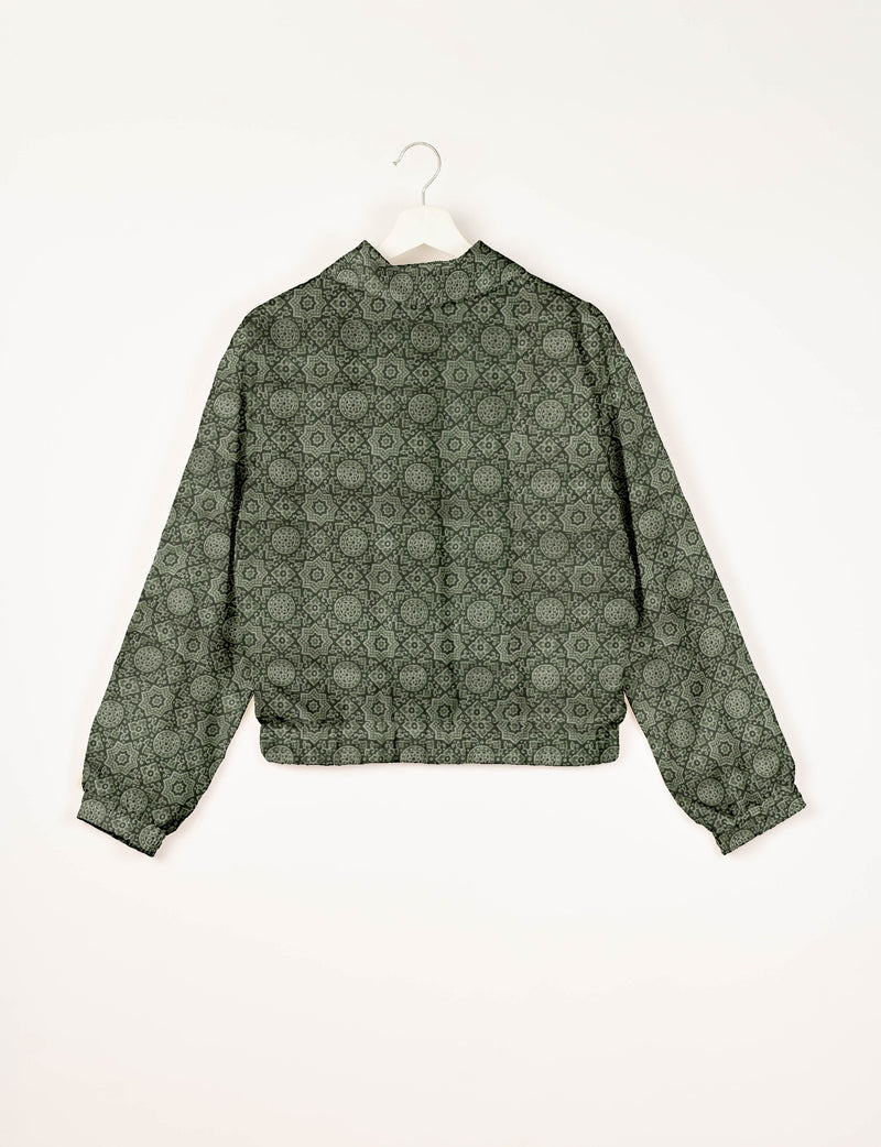 Green bomber jacket with Indian ethnic geometric pattern, long sleeves, elastic cuffs, and back view on white hanger