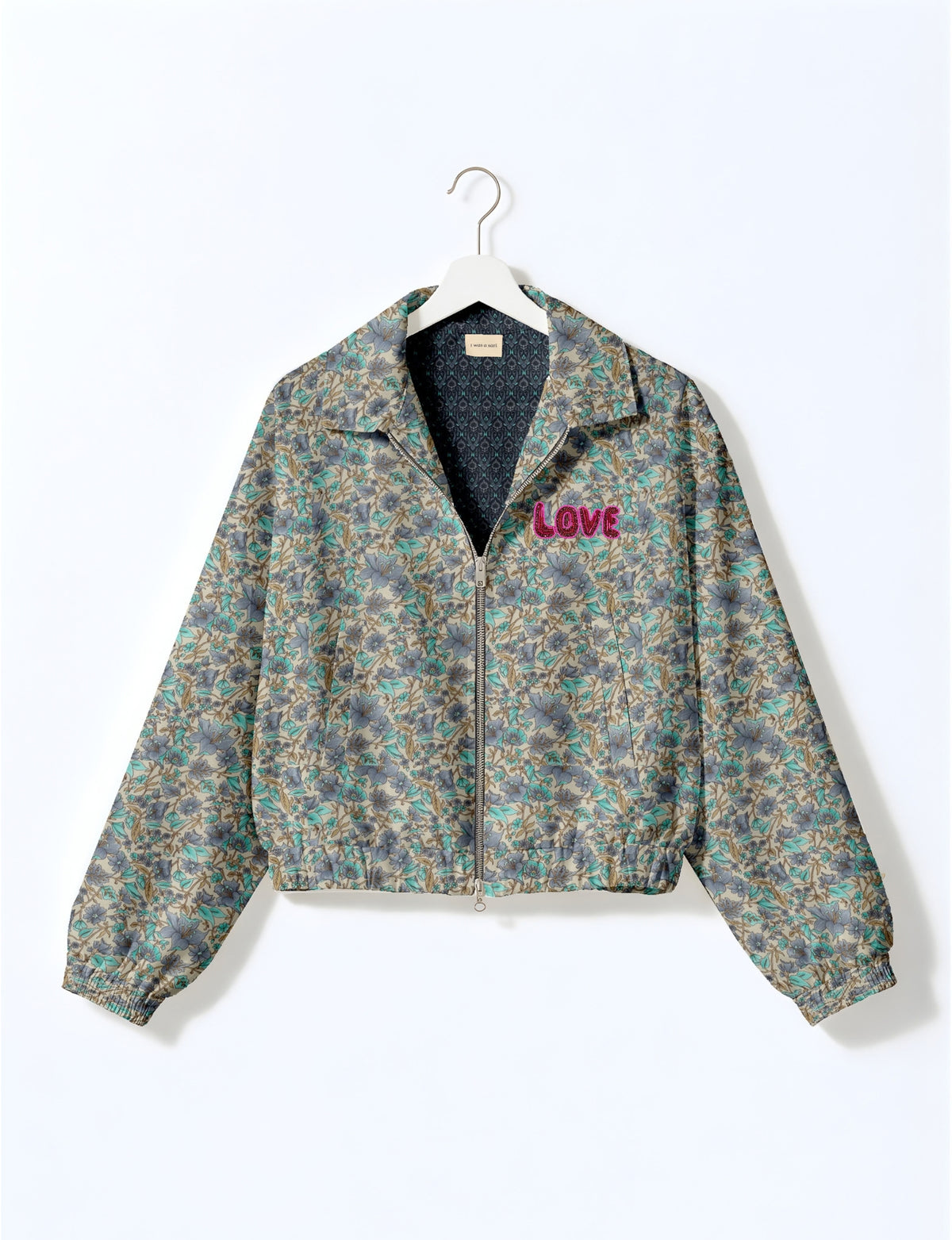 Love Bomber Jacket made from recycled fabric, featuring hand-stitched Aari embroidery. A unique piece of zero-waste clothing, part of the circular fashion movement. Designed with upcycled materials for a stylish yet environmentally friendly clothing choice.