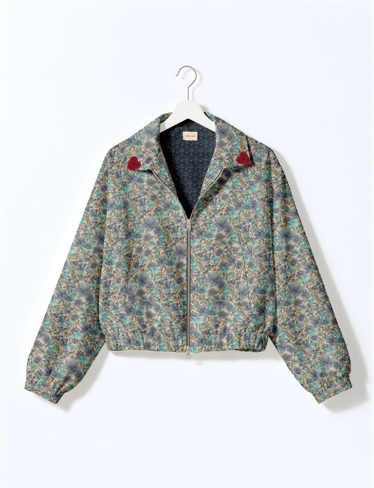 Love Bomber Jacket made from recycled fabric, featuring hand-stitched Aari embroidery. A unique piece of zero-waste clothing, part of the circular fashion movement. Designed with upcycled materials for a stylish yet environmentally friendly clothing choice.