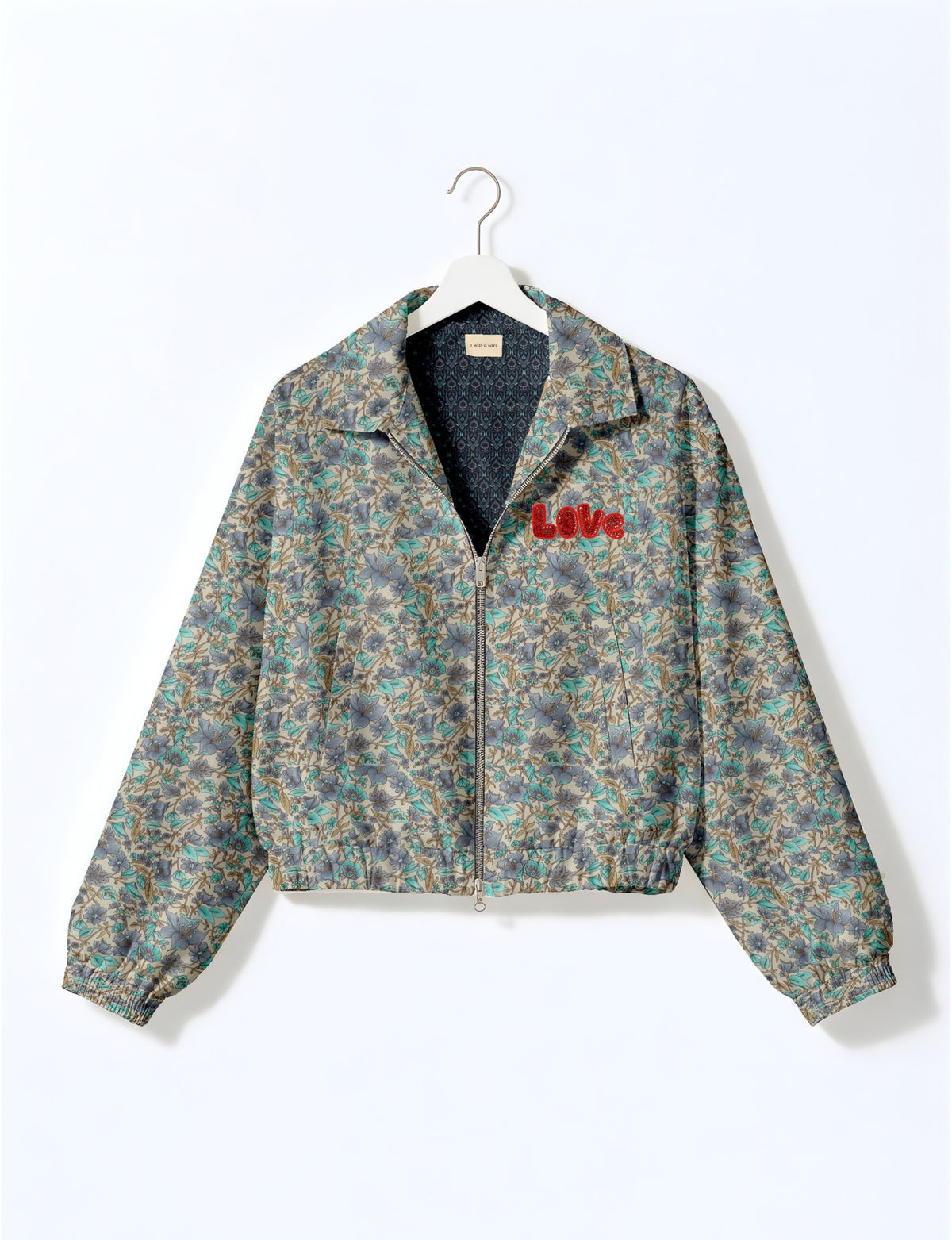 Love Bomber Jacket made from recycled fabric, featuring hand-stitched Aari embroidery. A unique piece of zero-waste clothing, part of the circular fashion movement. Designed with upcycled materials for a stylish yet environmentally friendly clothing choice.
