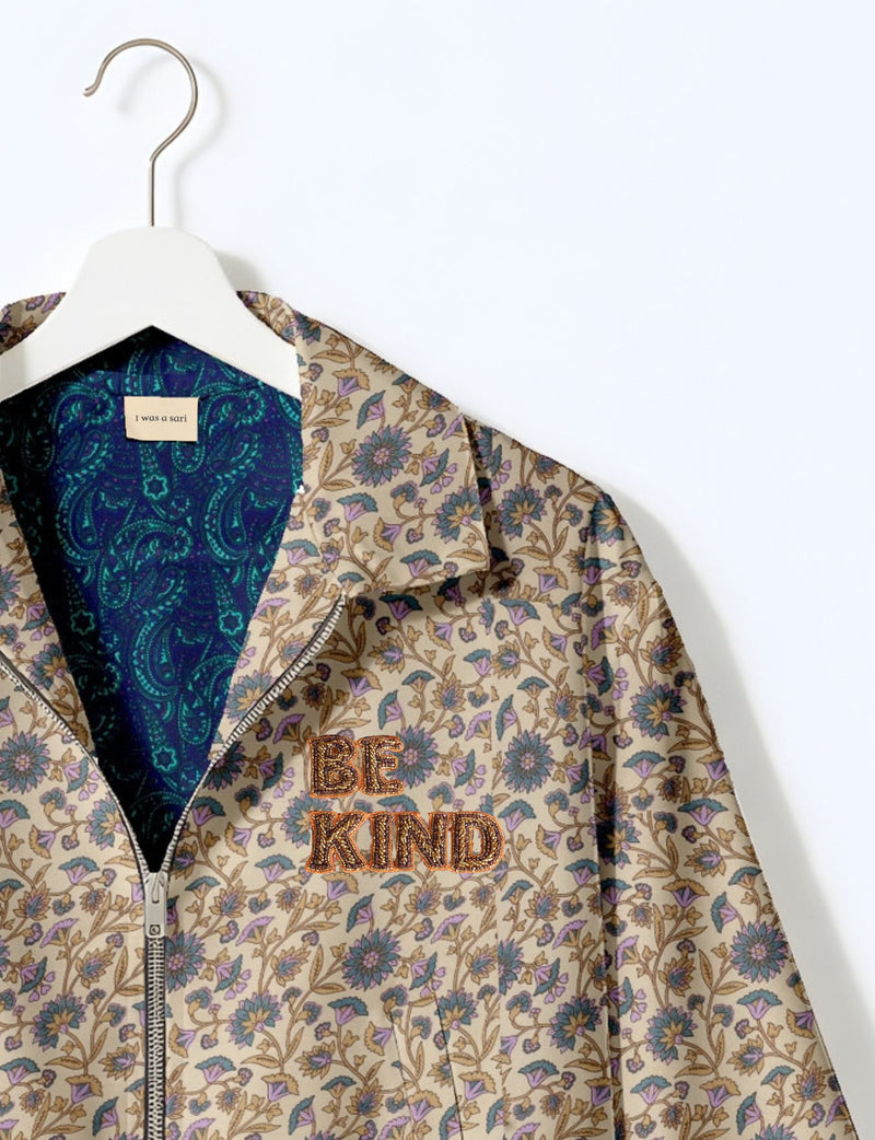 BE KIND Bomber jacket made from upcycled sari fabric with handcrafted Aari embroidery by female artisans.