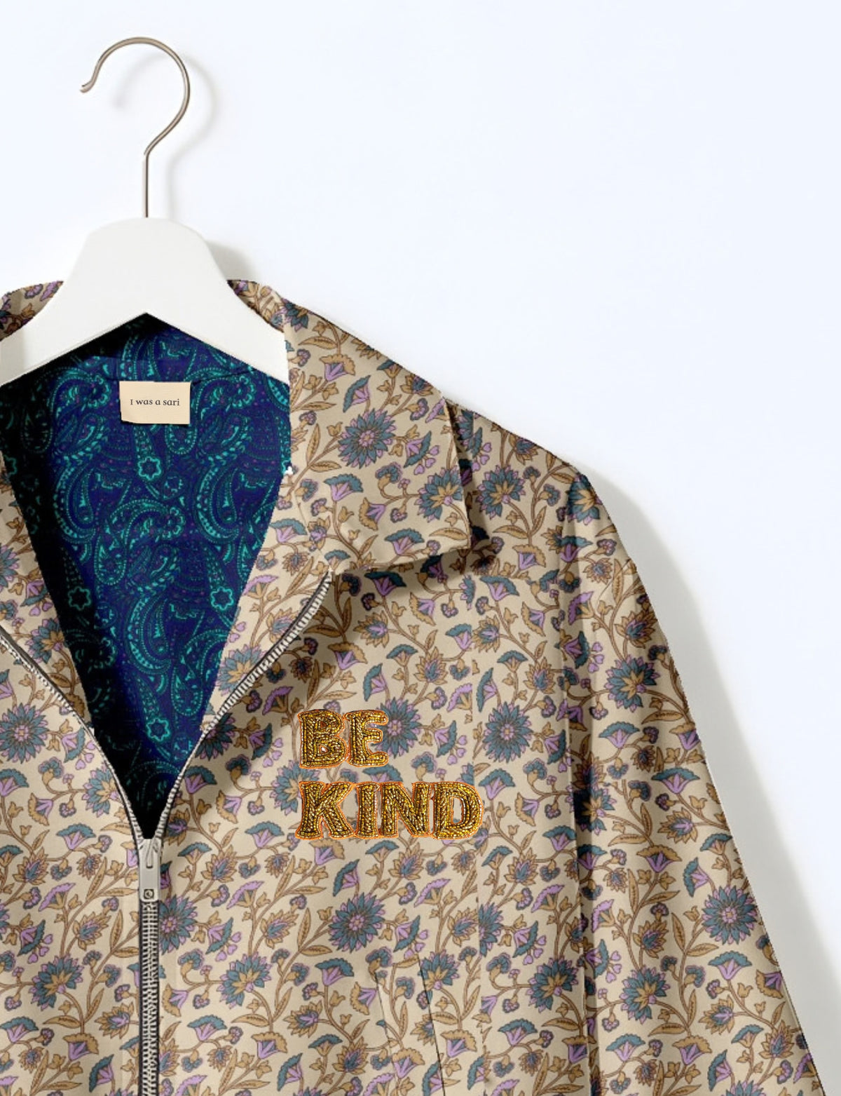 BE KIND Bomber jacket made from upcycled sari fabric with handcrafted Aari embroidery by female artisans.
