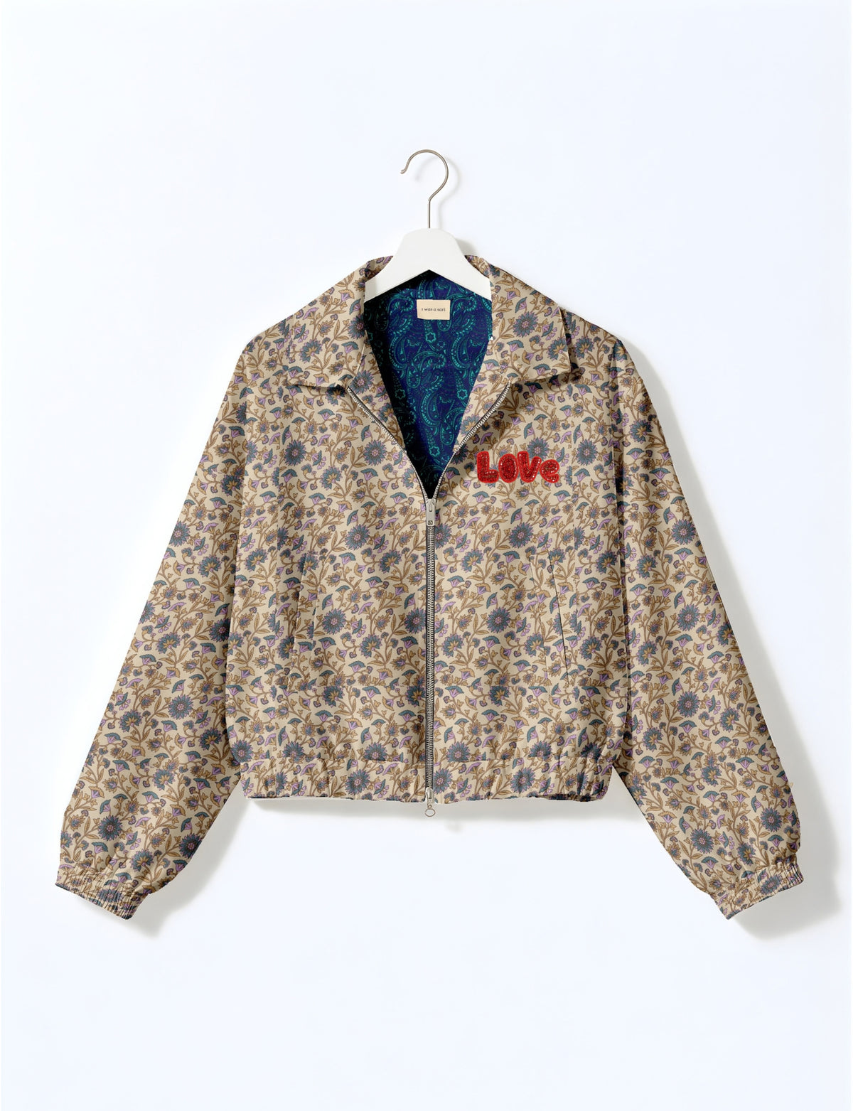 Love Bomber Jacket made from recycled fabric, featuring hand-stitched Aari embroidery. A unique piece of zero-waste clothing, part of the circular fashion movement. Designed with upcycled materials for a stylish yet environmentally friendly clothing choice.