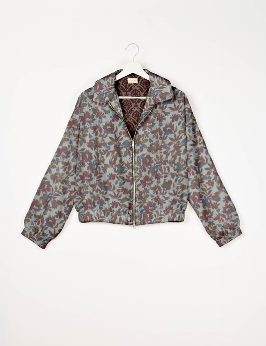 Upcycled Bomber Jacket made from recycled sari materials, featuring a cute cropped shape, elasticated hem and cuffs, and contrast sari print lining. Sustainable apparel promoting eco-friendly fashion and ethical clothing.