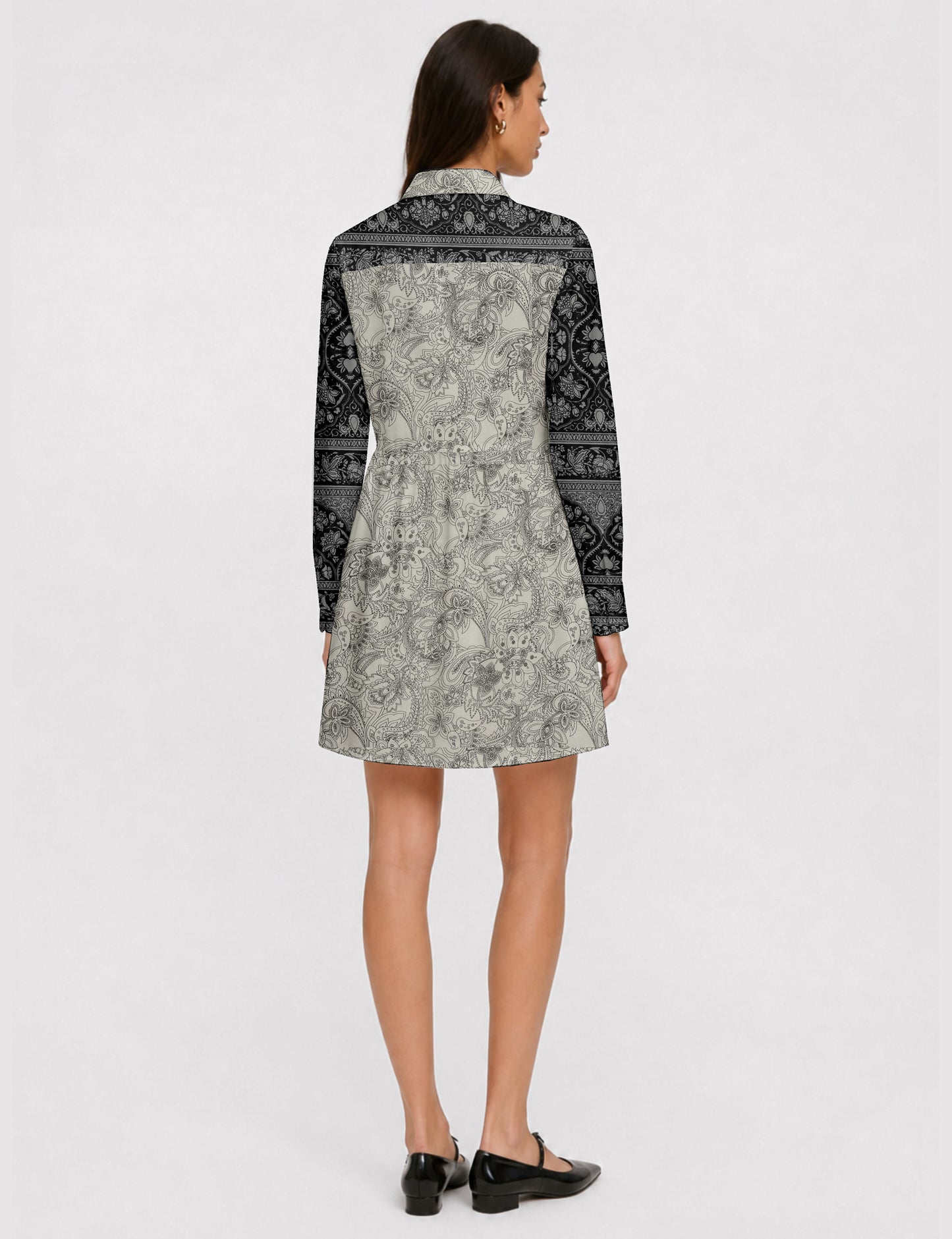Short shirt dress with a relaxed A-line silhouette, point collar, partial button placket, gathered waist, side pockets, and full-length cuffed sleeves.