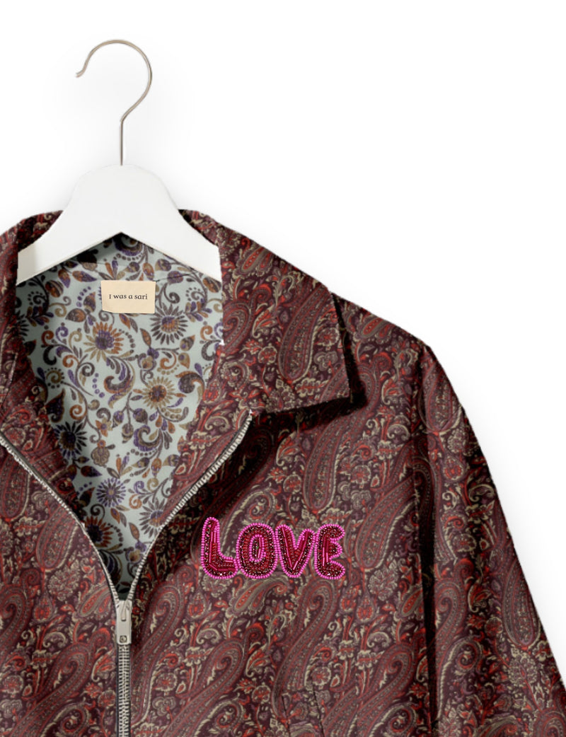 Love Bomber Jacket made from recycled fabric, featuring hand-stitched Aari embroidery. A unique piece of zero-waste clothing, part of the circular fashion movement. Designed with upcycled materials for a stylish yet environmentally friendly clothing choice.