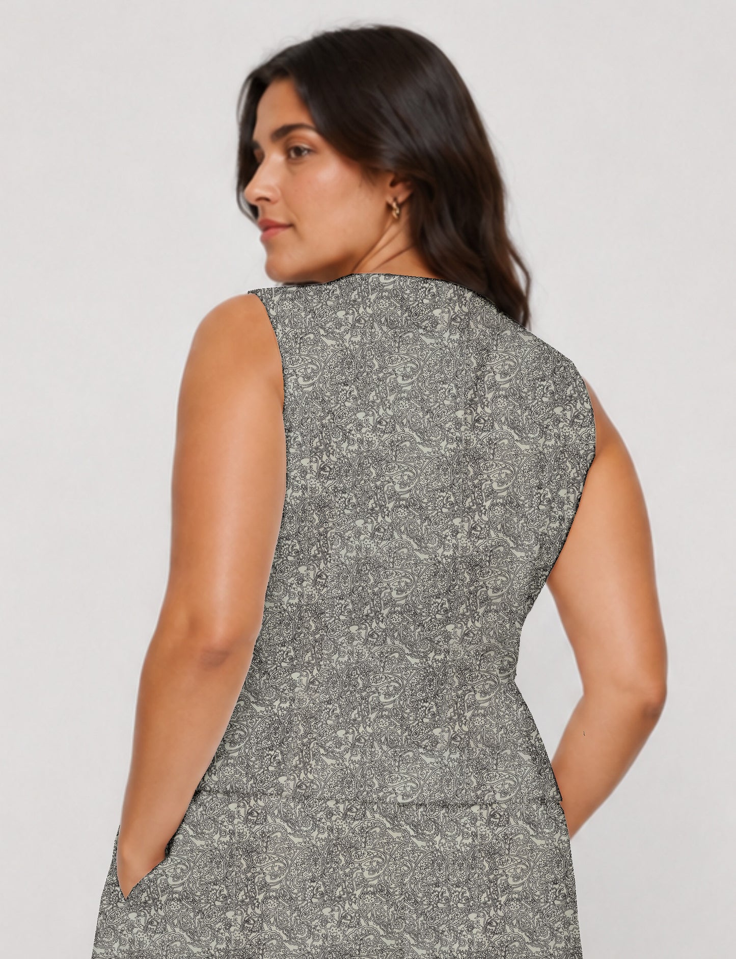 Women's fitted waistcoat with V-neck, single-breasted button closure, tailored silhouette, and pointed hem in sustainable fashion.