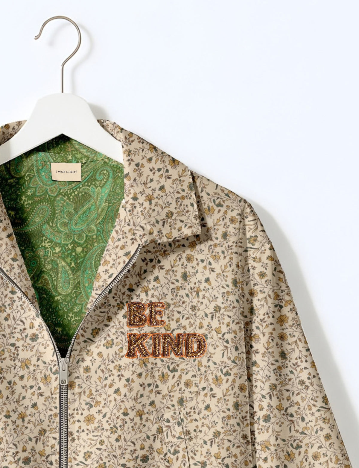 BE KIND Bomber jacket made from upcycled sari fabric with handcrafted Aari embroidery by female artisans.