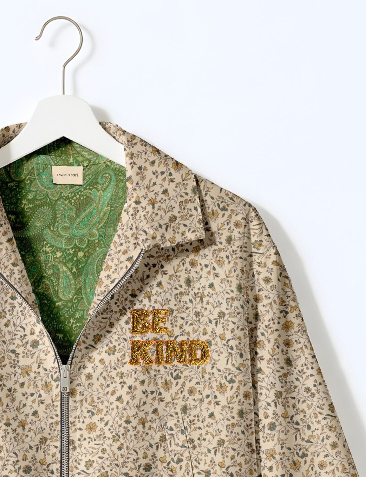 BE KIND Bomber jacket made from upcycled sari fabric with handcrafted Aari embroidery by female artisans.