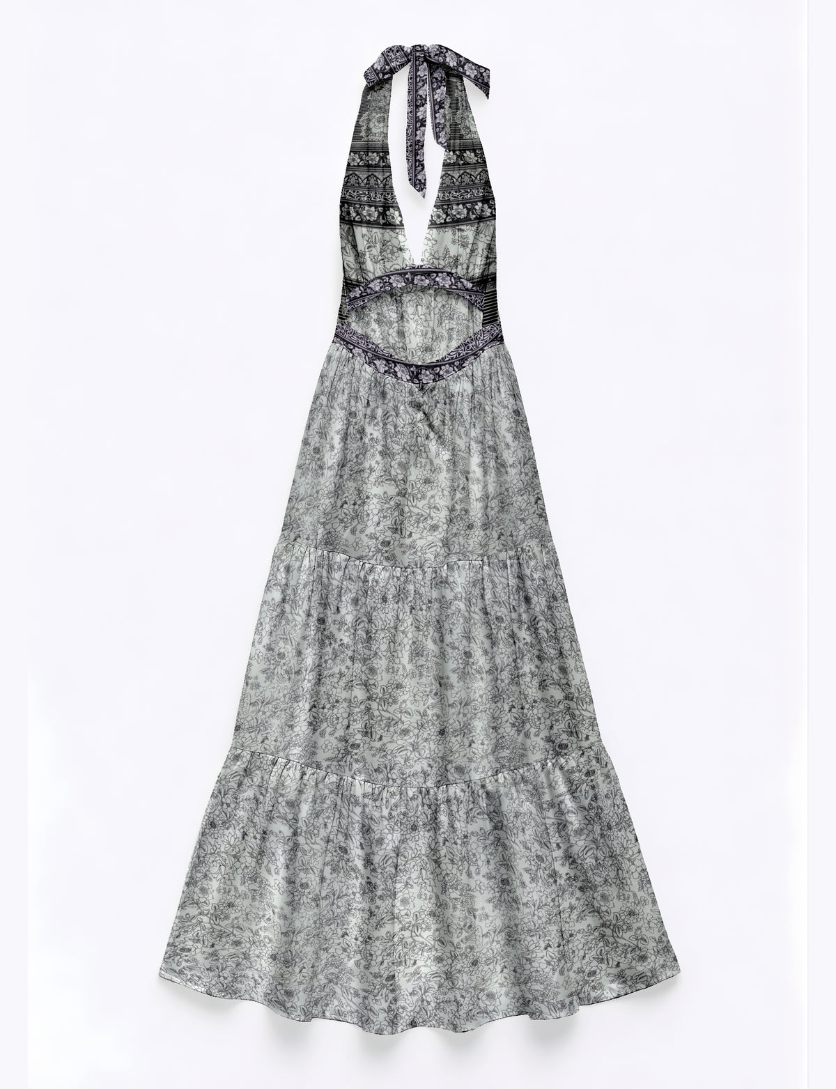 White maxi tiered dress with black floral and geometric patterns, halter neck tie, and cutout waist, flat lay view