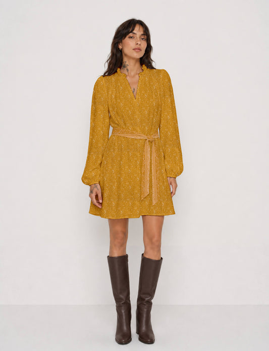 Swing dress with detachable tie belt, gathered ruffle neckline, full-length voluminous sleeves, elastic cuffs, and relaxed A-line silhouette in an above-knee length.