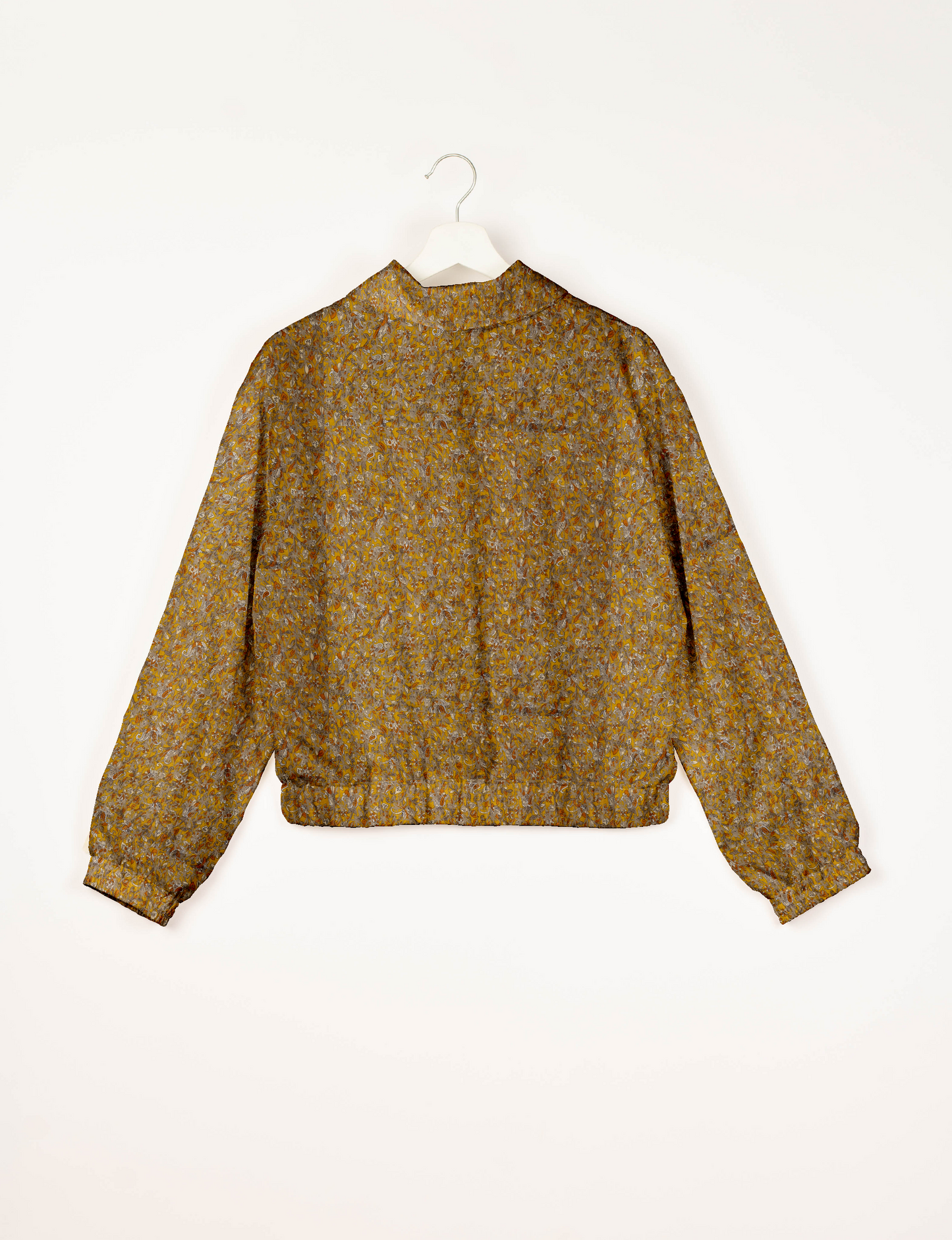 Upcycled Bomber Jacket made from recycled sari materials, featuring a cute cropped shape, elasticated hem and cuffs, and contrast sari print lining. Sustainable apparel promoting eco-friendly fashion and ethical clothing.