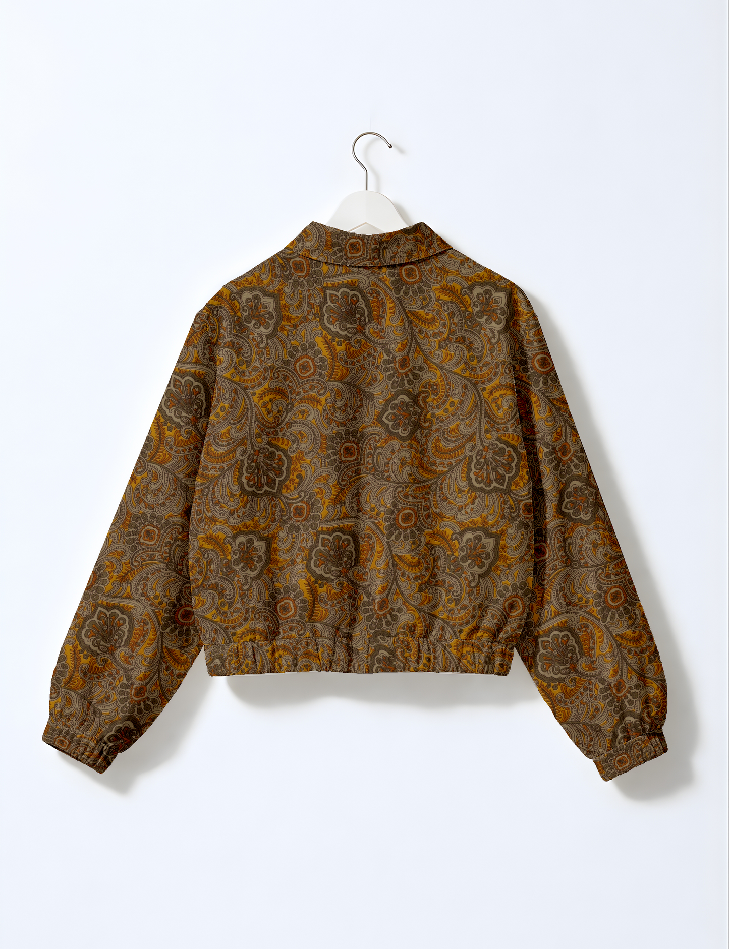 Upcycled Bomber Jacket made from recycled sari materials, featuring a cute cropped shape, elasticated hem and cuffs, and contrast sari print lining. Sustainable apparel promoting eco-friendly fashion and ethical clothing.
