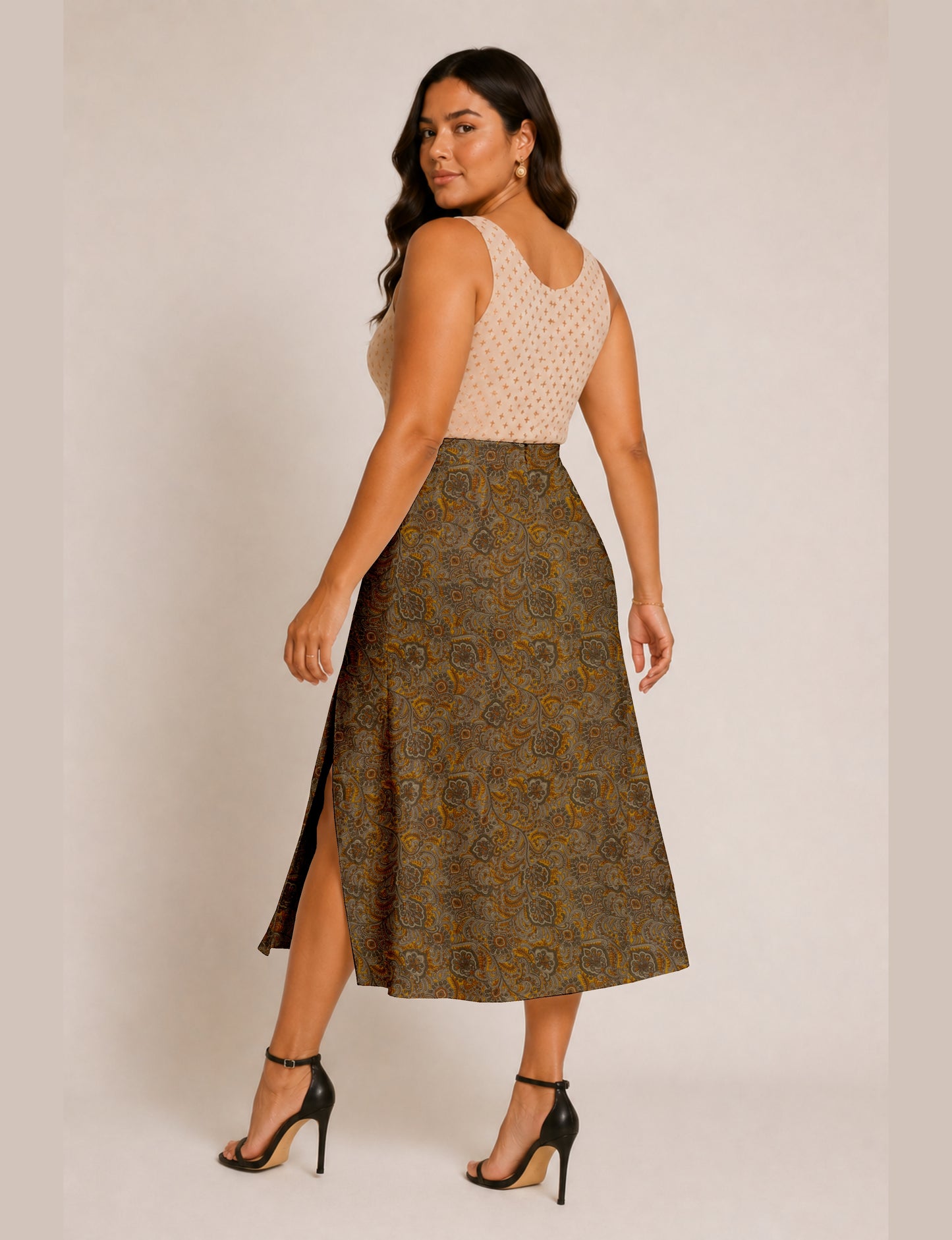 Midi A-line skirt with front slit, fitted waistband, concealed side closure, and below mid-calf length silhouette.