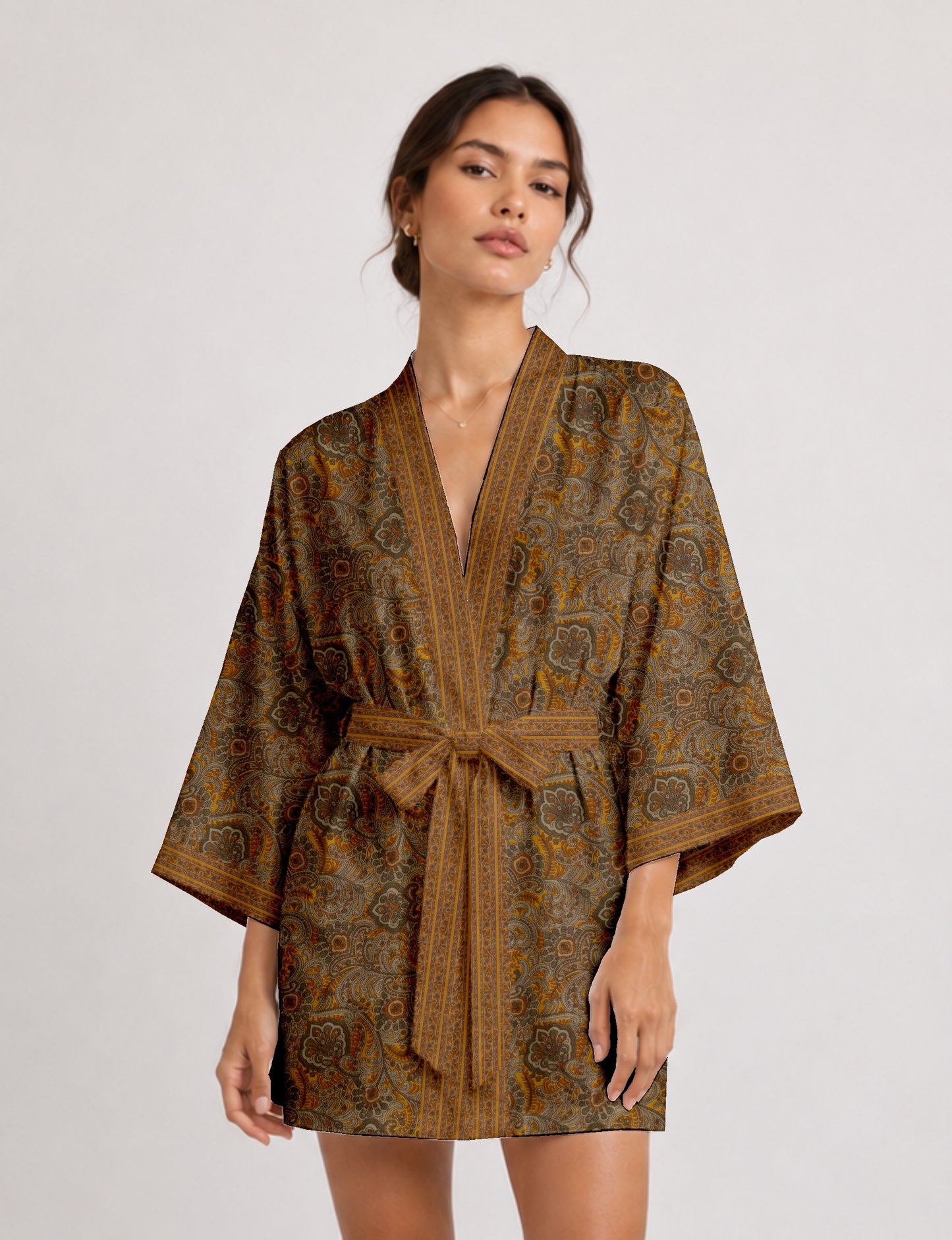 Short kimono robe with wrap front, V-neckline, wide sleeves, waist tie, and concealed skort detail.