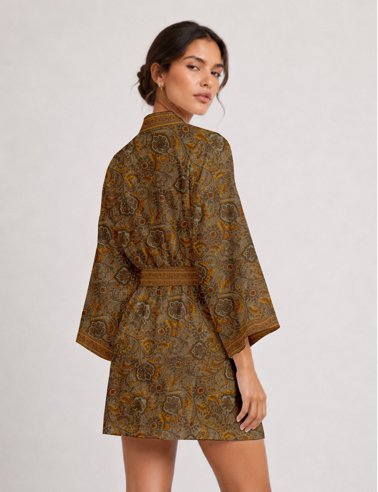 Short kimono robe with wrap front, V-neckline, wide sleeves, waist tie, and concealed skort detail.