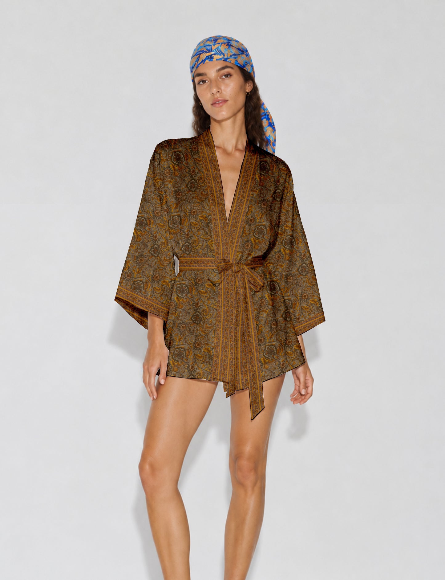 Short kimono robe with wrap front, V-neckline, wide sleeves, waist tie, and concealed skort detail.