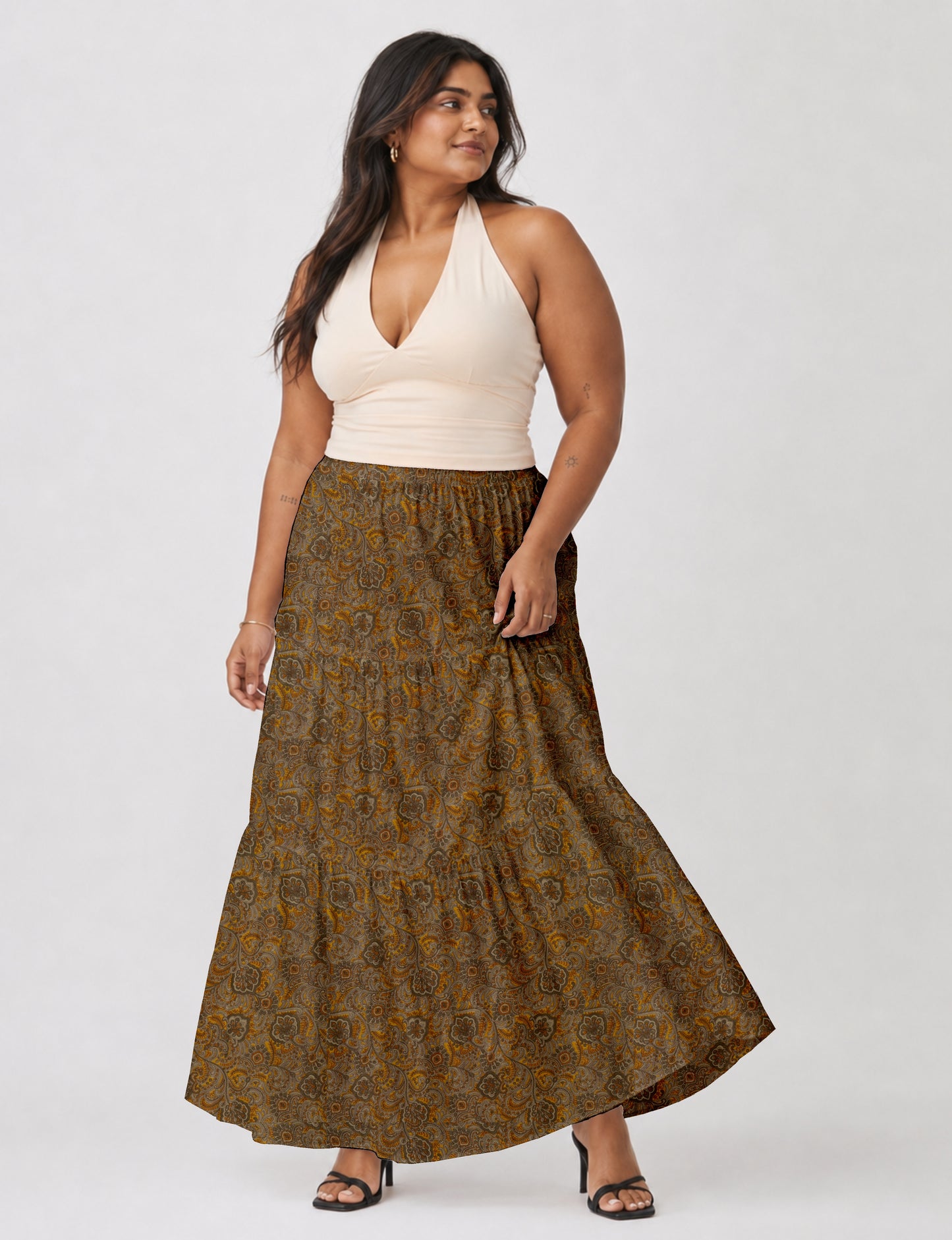 Midi tiered skirt with fitted waistband, soft knife pleats, flared silhouette, side seam pockets, and ankle-length hem