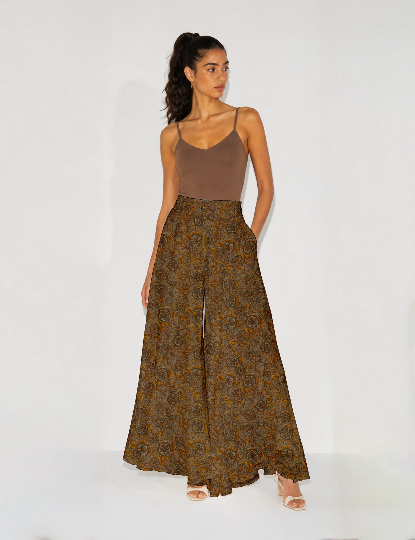 Women's wide leg palazzo trousers with a fitted waistband and relaxed flowing silhouette.