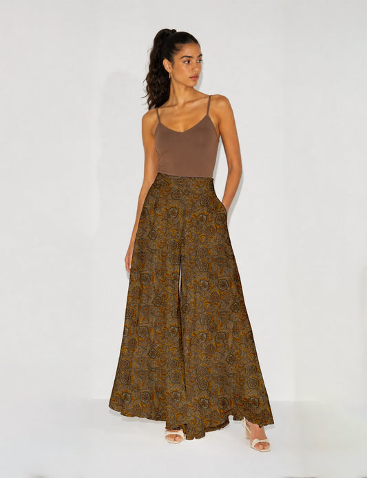 Women's wide leg palazzo trousers with a fitted waistband and relaxed flowing silhouette.