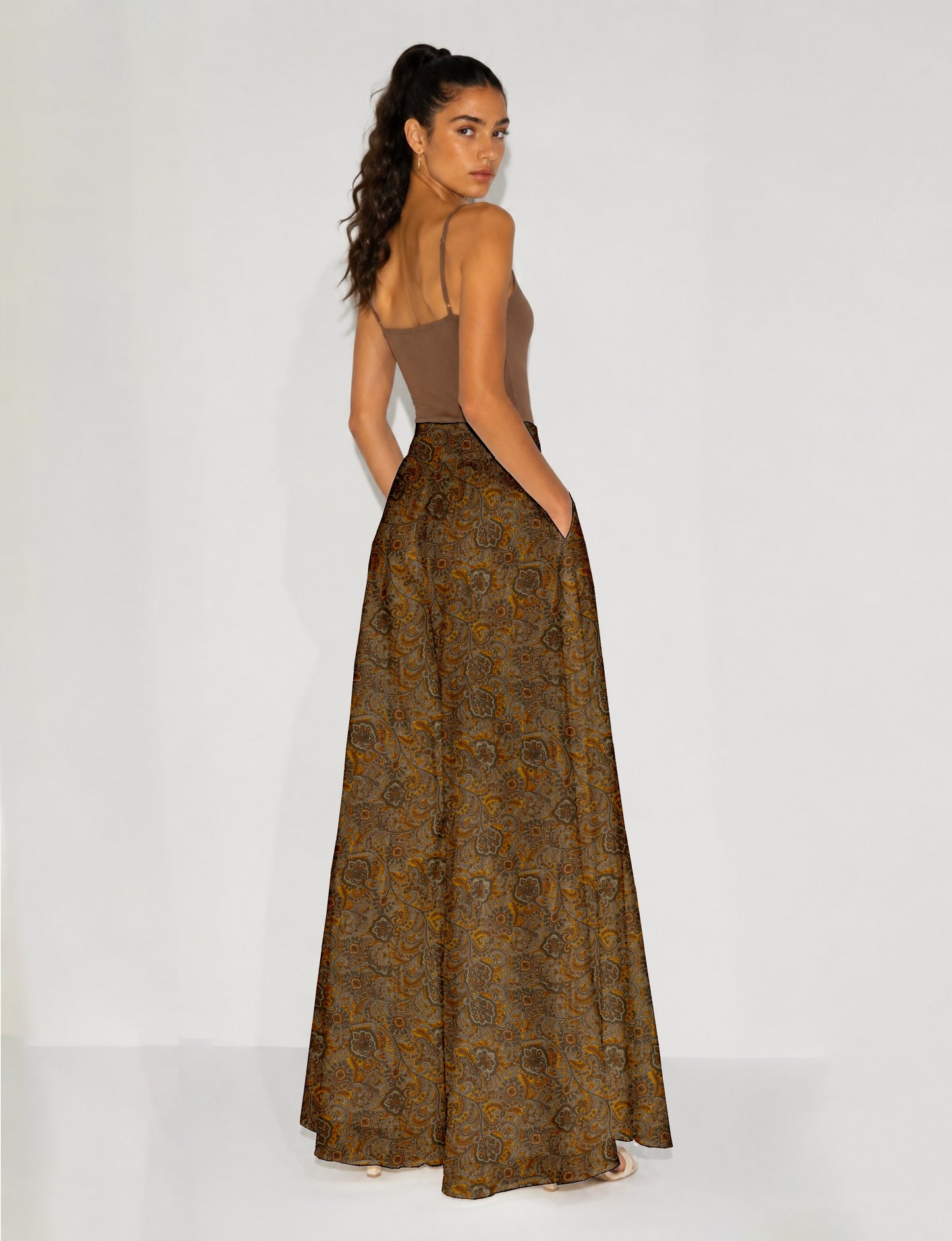 Women's wide leg palazzo trousers with a fitted waistband and relaxed flowing silhouette.