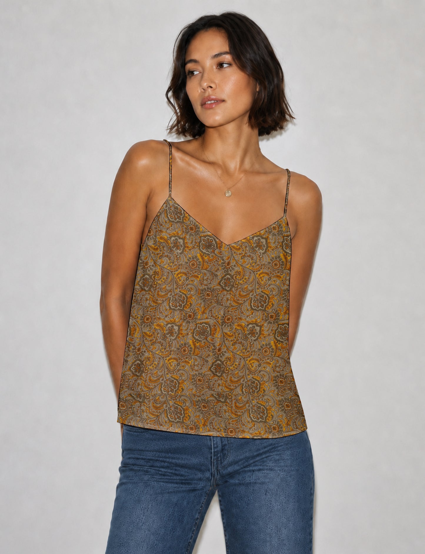 Women's sleeveless slip top with a relaxed straight fit, soft V-neckline, deep V-back, and delicate spaghetti straps.