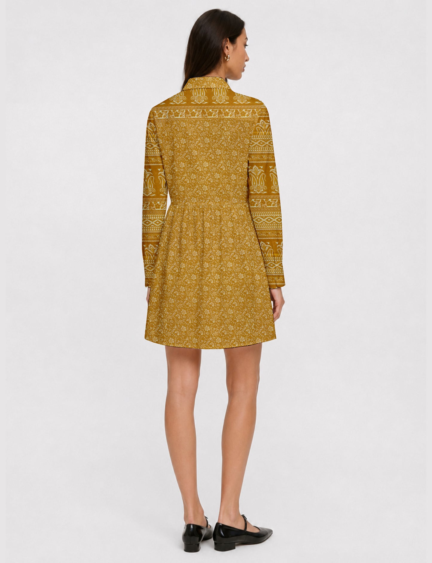 Short shirt dress with a relaxed A-line silhouette, point collar, partial button placket, gathered waist, side pockets, and full-length cuffed sleeves.